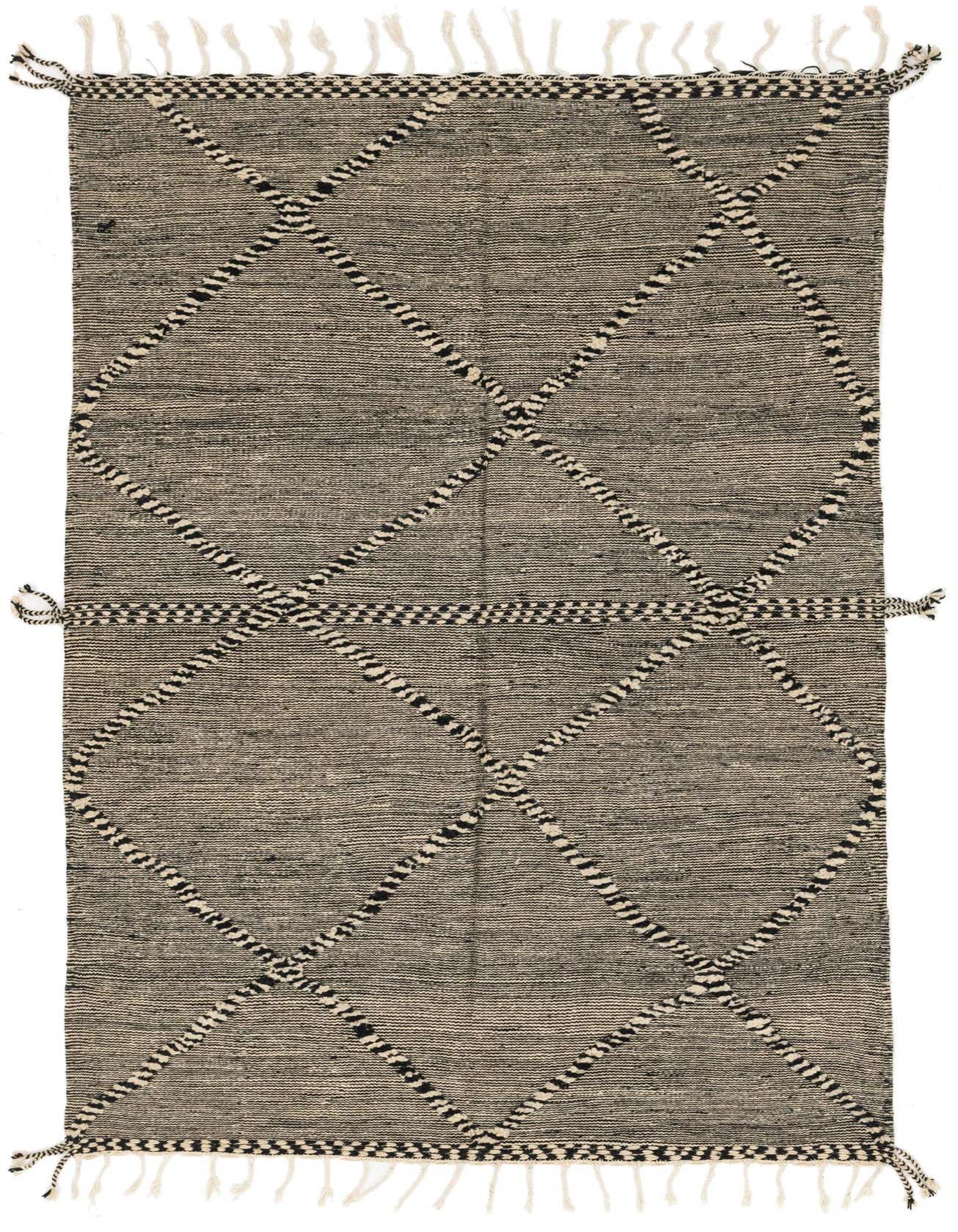 A 6x9 rectangular Moroccan shag rug in black and ivory, featuring a bold tribal diamond pattern and fringe.