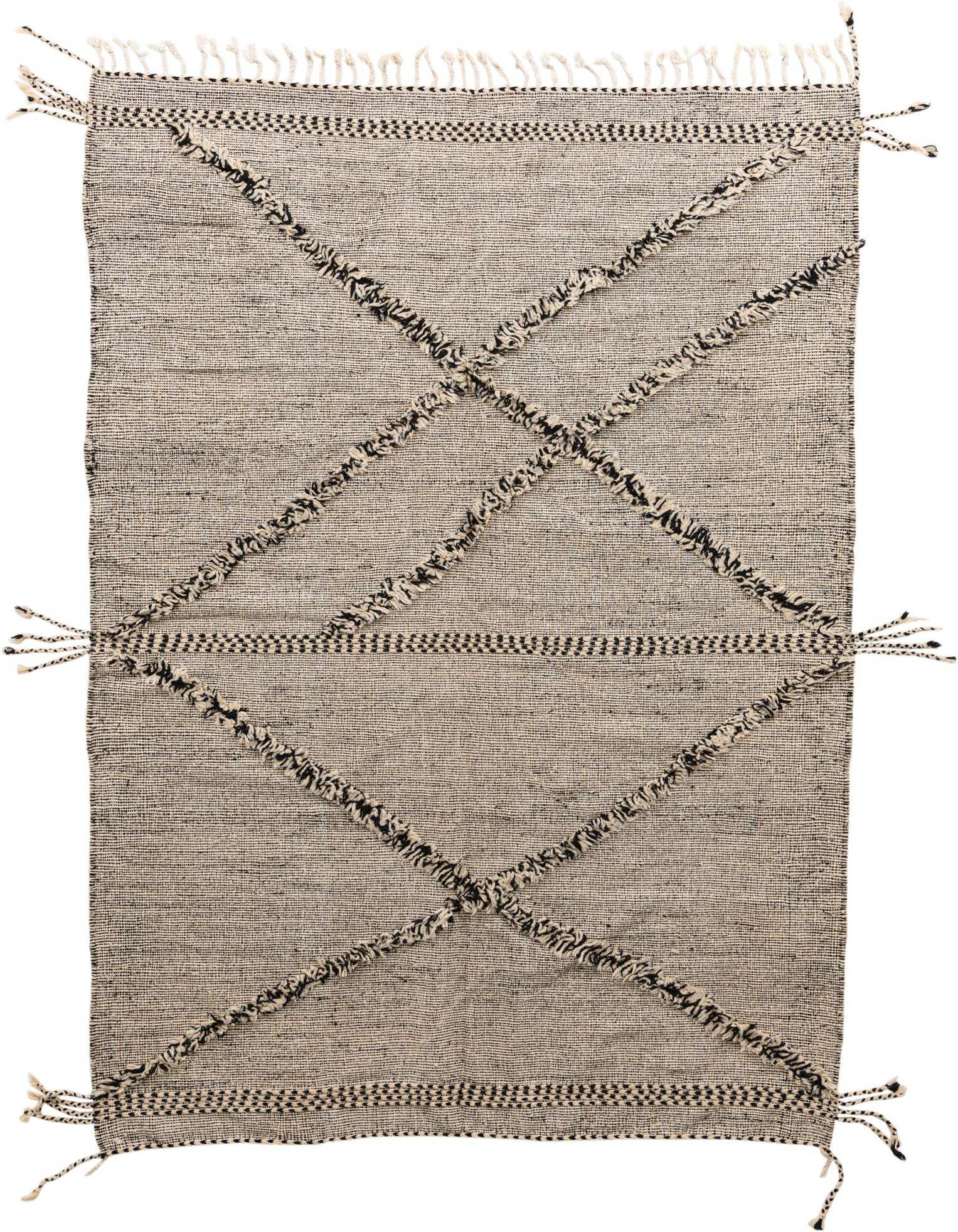 A 7x10 rectangular Moroccan shag rug in black and ivory, featuring a tribal diamond pattern with tassels.
