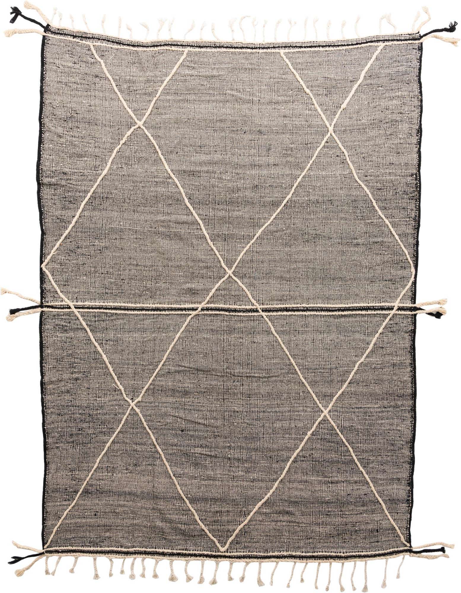 A 10x13 rectangular black wool shag rug with a cream tribal diamond pattern and fringe.