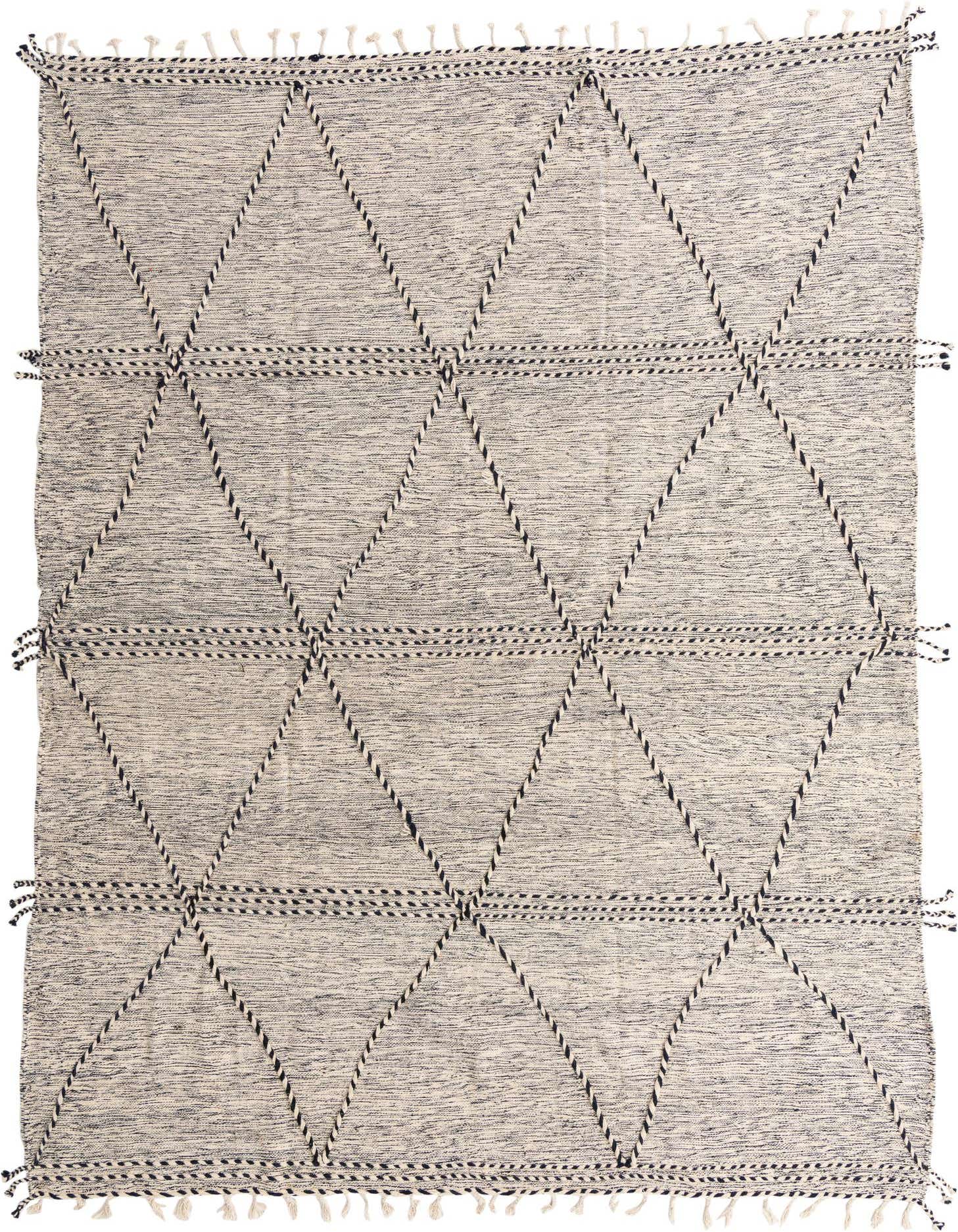 A 9x12 rectangular black and white tribal shag rug with a modern geometric diamond pattern and fringe.