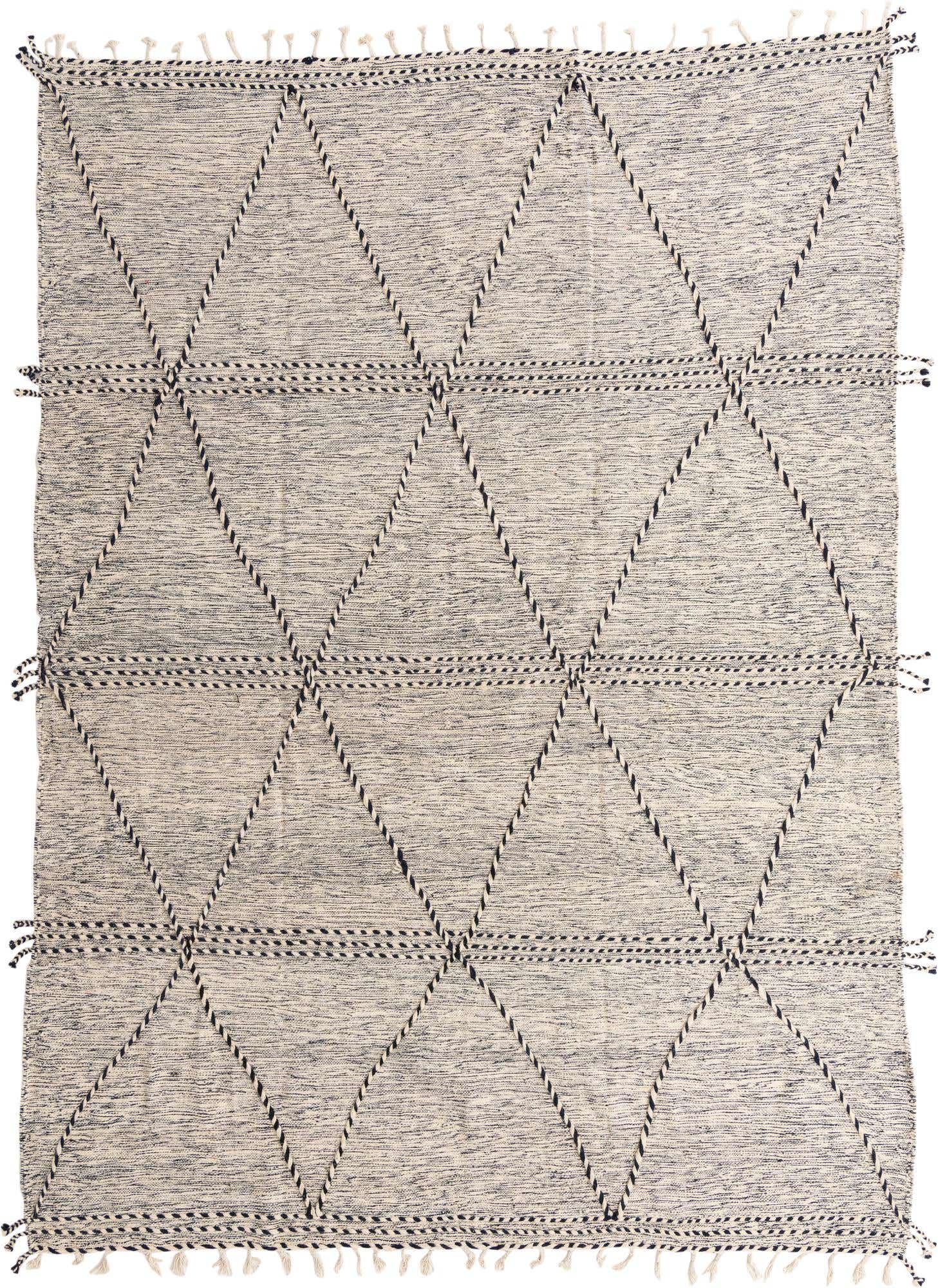 A 9x12 rectangular black and white tribal shag rug with a modern geometric diamond pattern and fringe.