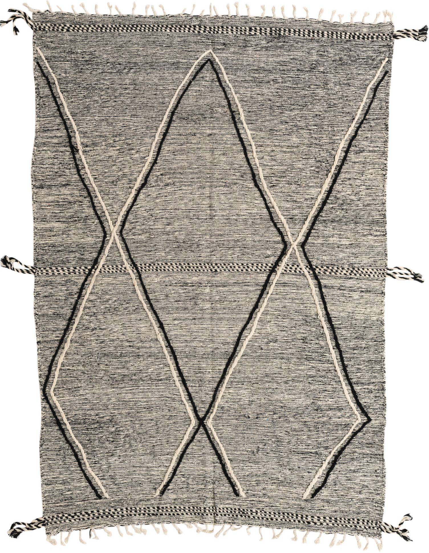 A 6x9 rectangular Moroccan shag rug with a black and white tribal diamond pattern and fringe.