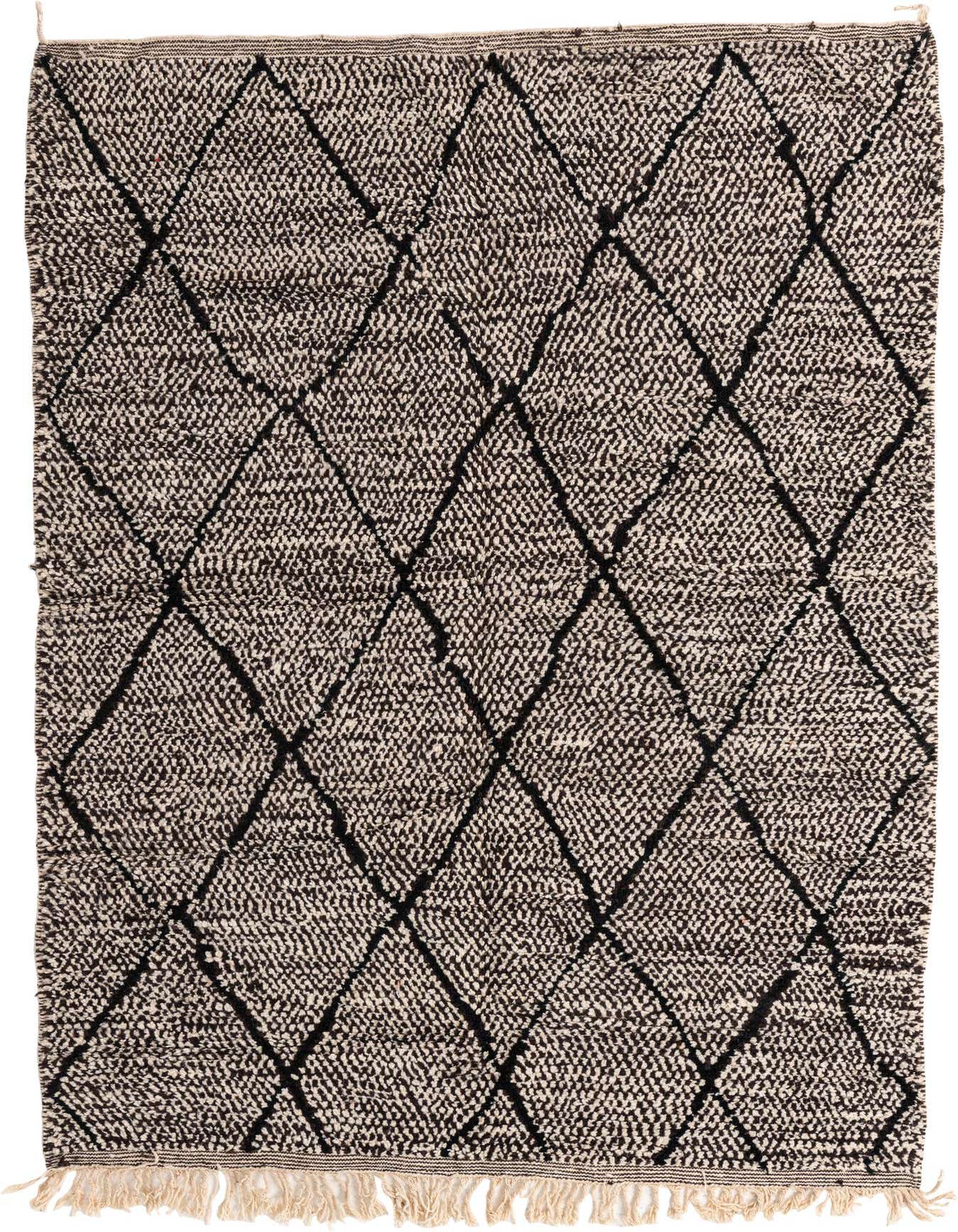 A 6x9 rectangular Moroccan shag rug with a tribal black diamond pattern on a textured ivory background, featuring fringe.