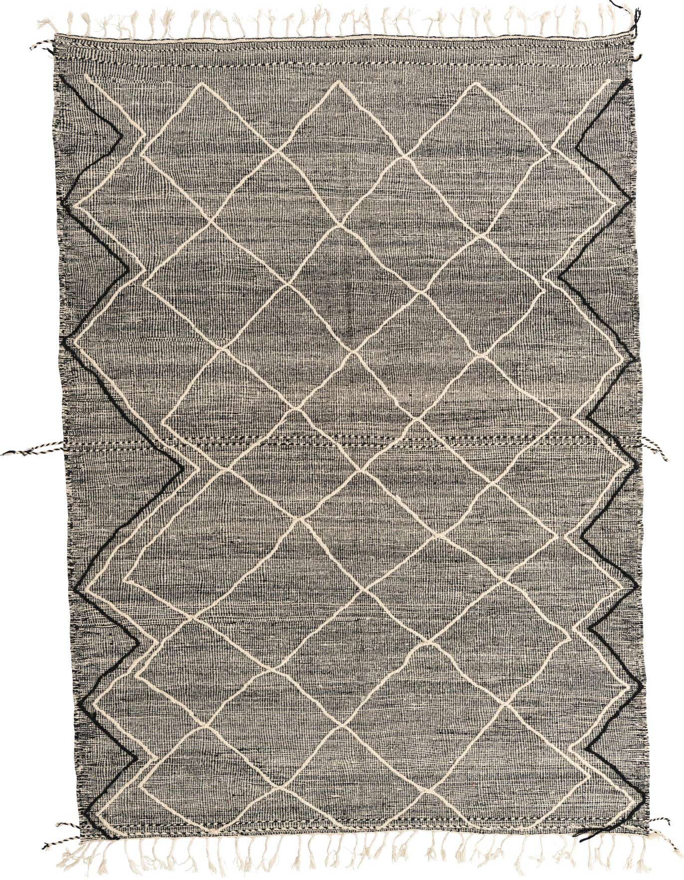 A 7x10 rectangular black and ivory tribal wool shag rug with a diamond pattern and fringe.