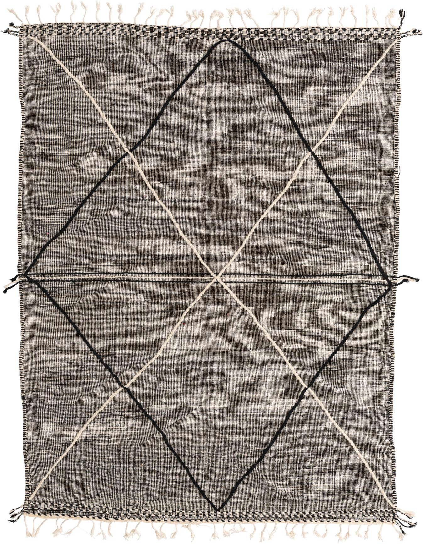 A 6x9 rectangular black and ivory wool shag rug with a bold tribal diamond pattern and fringe.