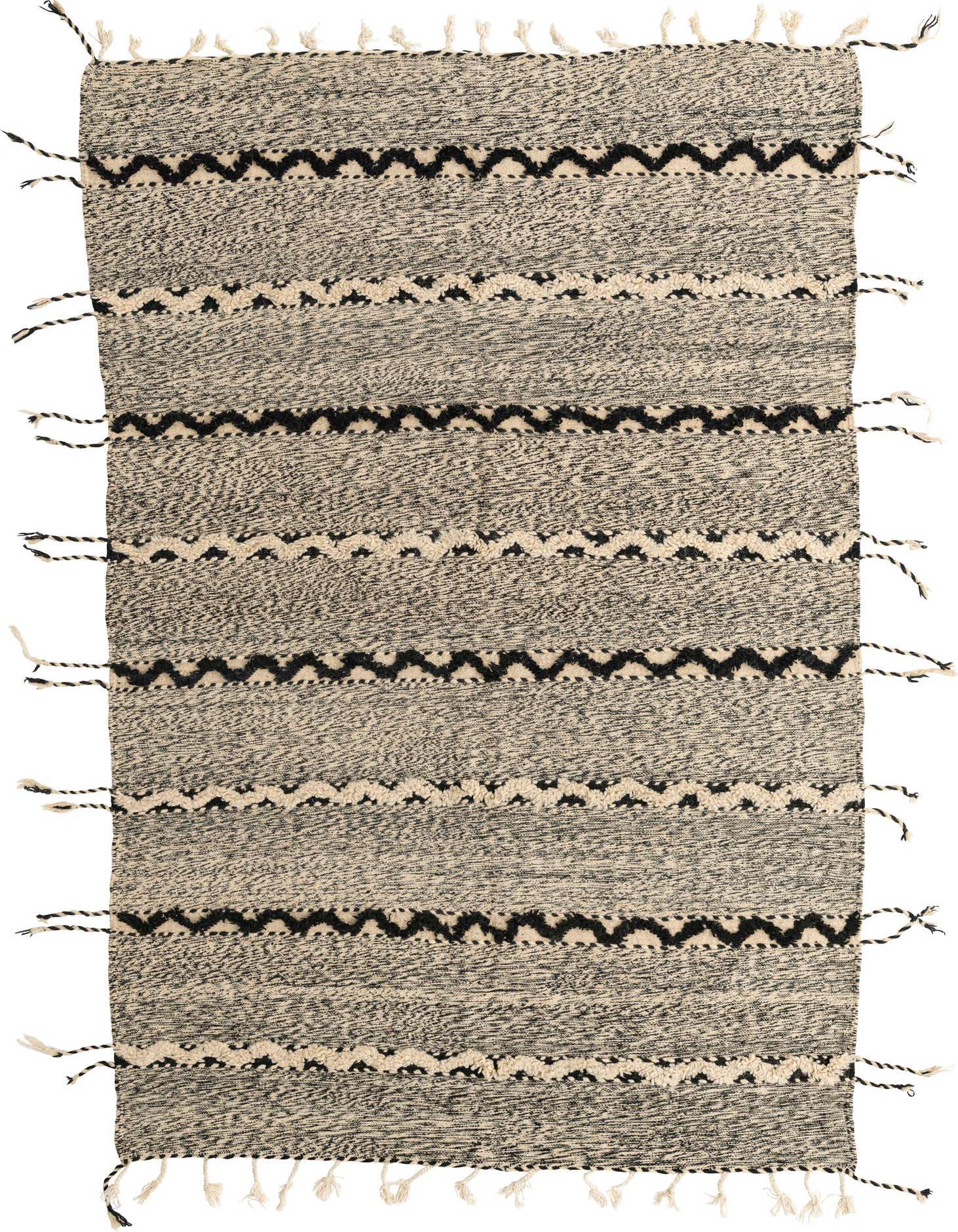 A 6x9 rectangular Moroccan shag rug in black and ivory with tribal zigzag patterns and tassels.
