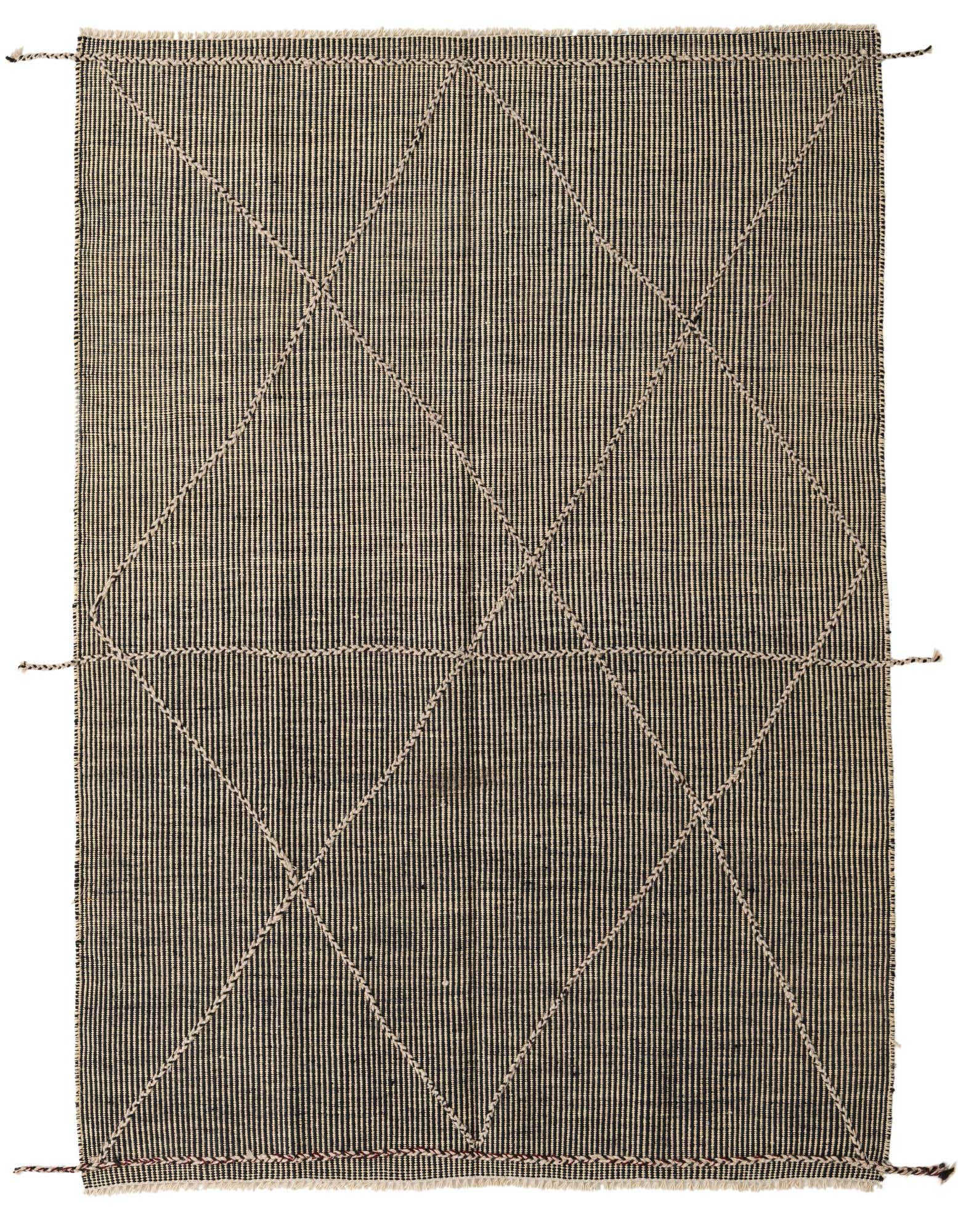 A 5x8 rectangular black and cream tribal wool shag rug with a modern geometric diamond pattern.