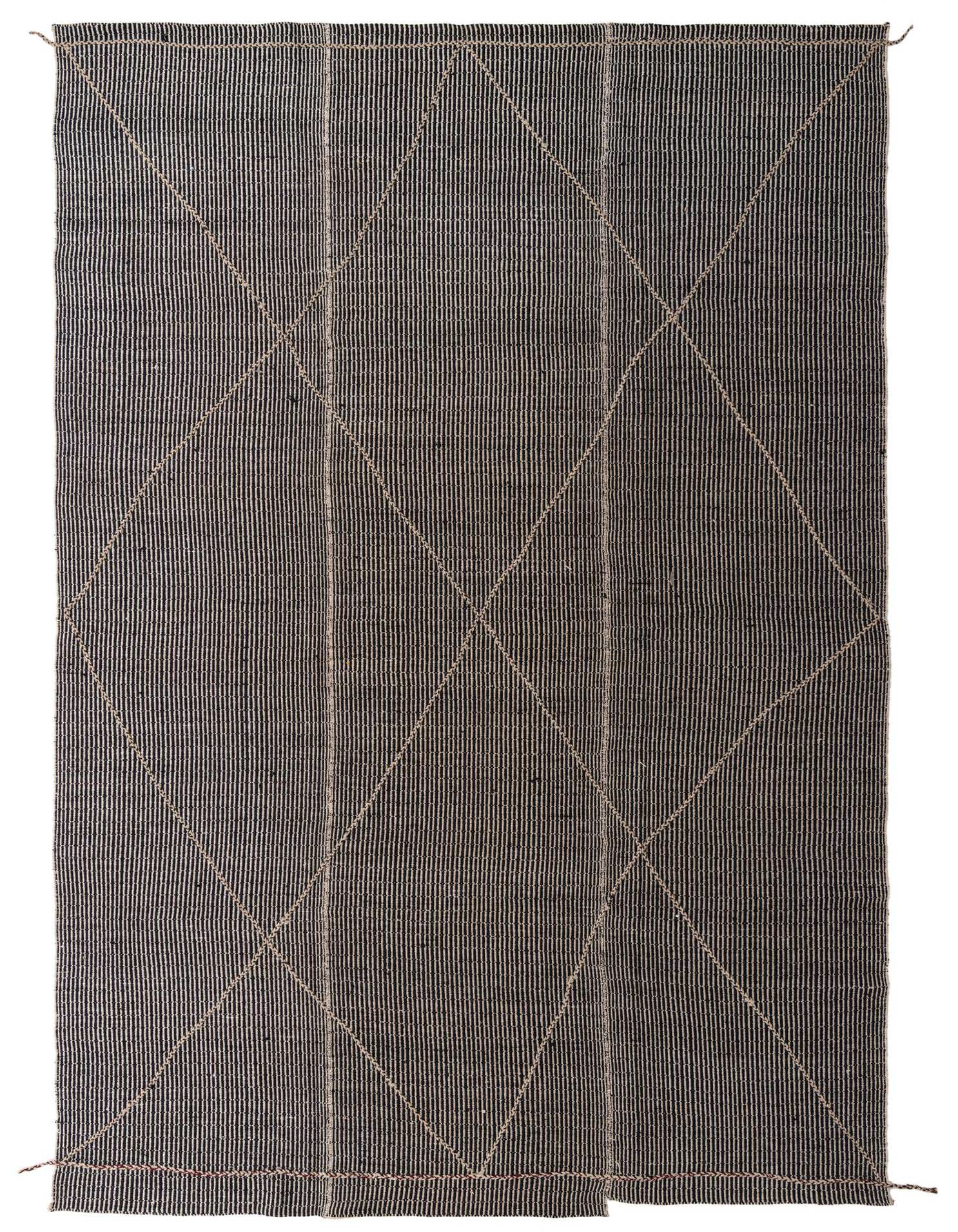 A 10x14 rectangular black and ivory shag rug with thin vertical stripes and a subtle tribal diamond pattern.