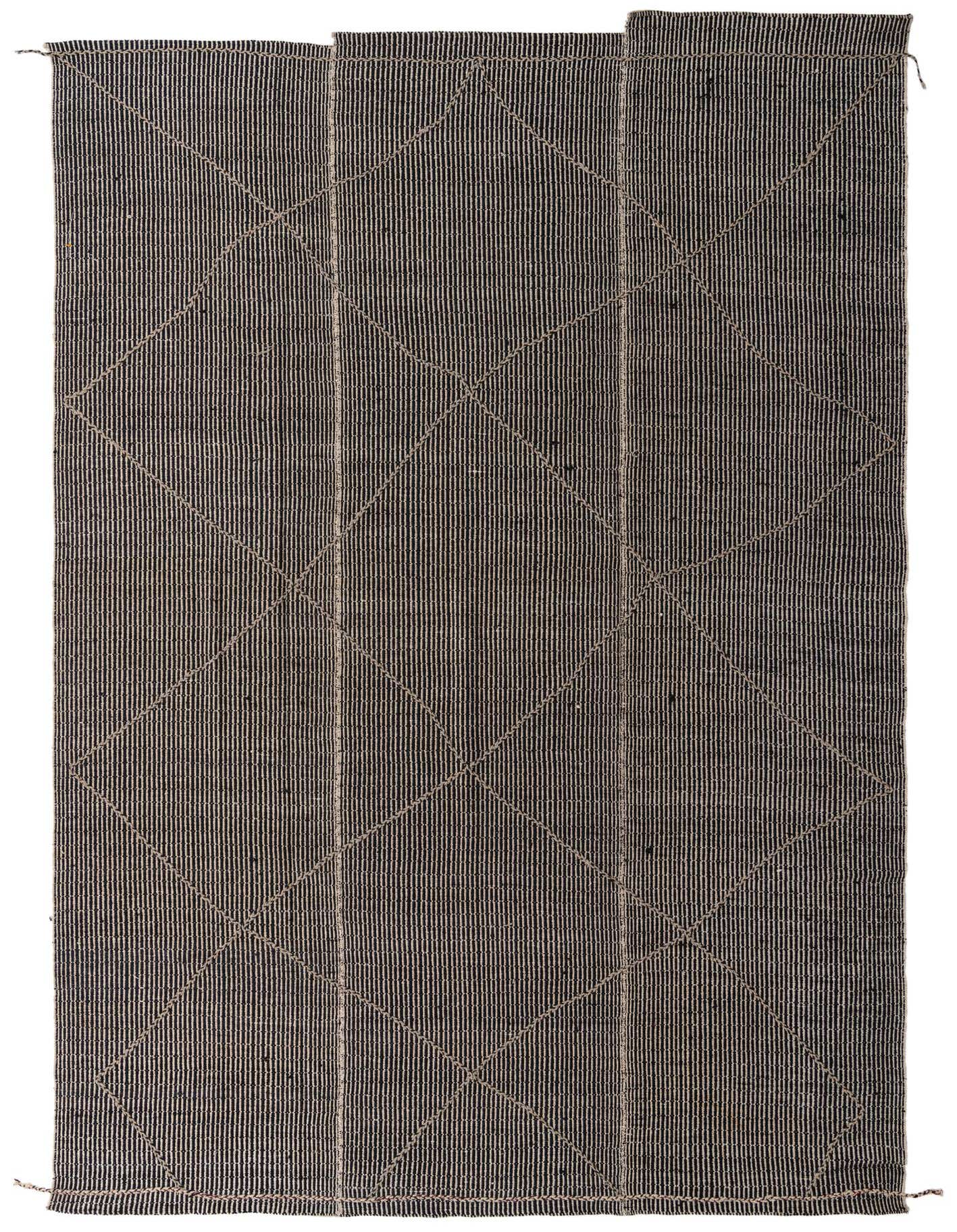 A 10x14 rectangular black shag rug with an ivory diamond tribal pattern, suitable for a modern living room.