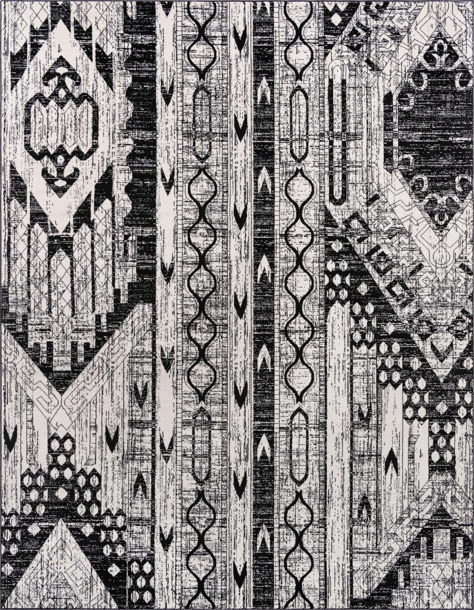 A 10x13 rectangular black and white bohemian rug with tribal and stripe patterns, featuring a textured pile.