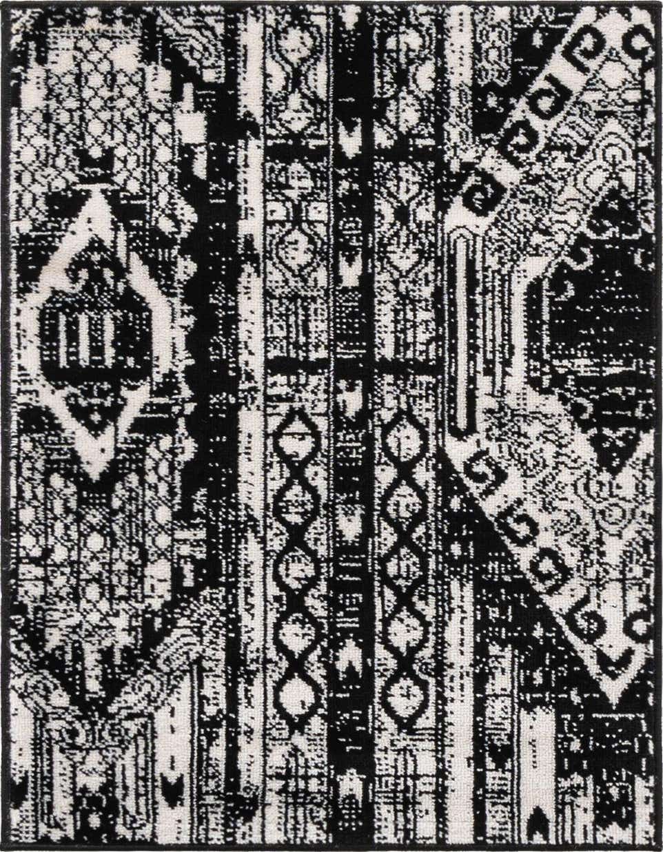 A 2x3 rectangular black and white bohemian rug with a distressed tribal stripe pattern, featuring various geometric motifs.