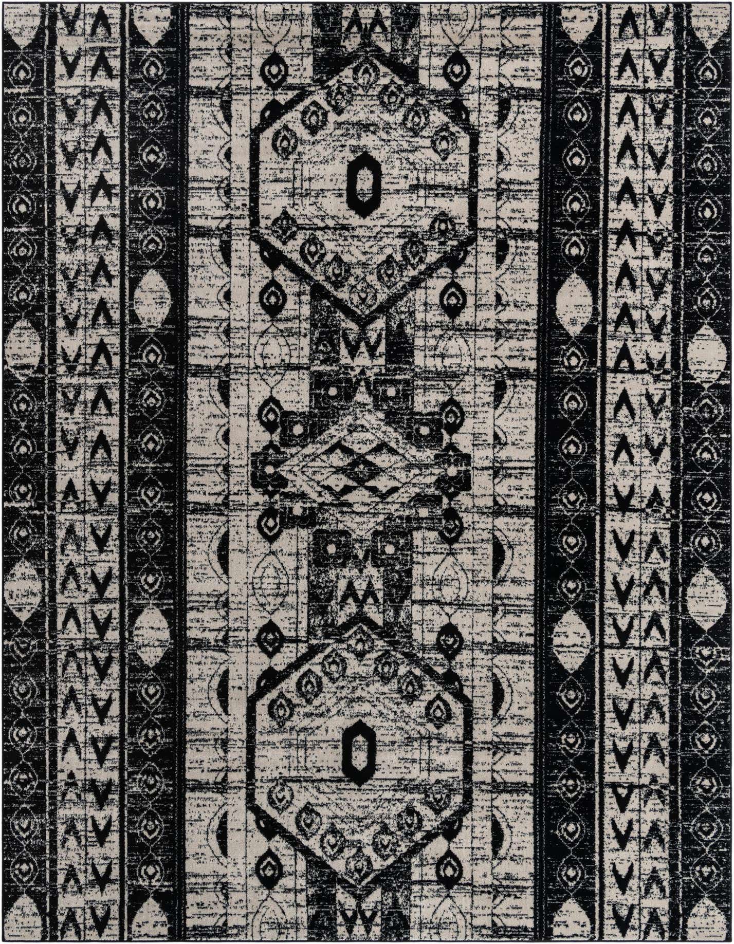 A 10x14 rectangular black and ivory Bohemian rug featuring distressed tribal patterns, geometric shapes, and vertical stripes, ideal for an indoor living space.