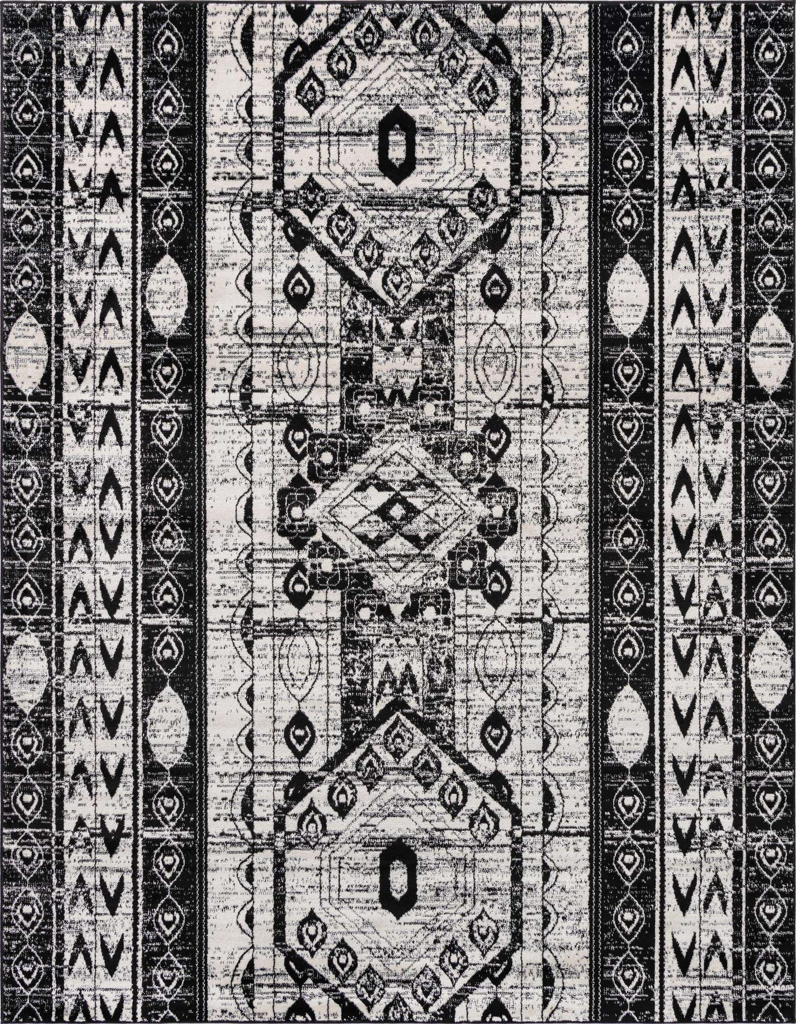 An 8x10 black and white rectangular Bohemian rug with distressed tribal patterns and stripes, ideal for a living room.