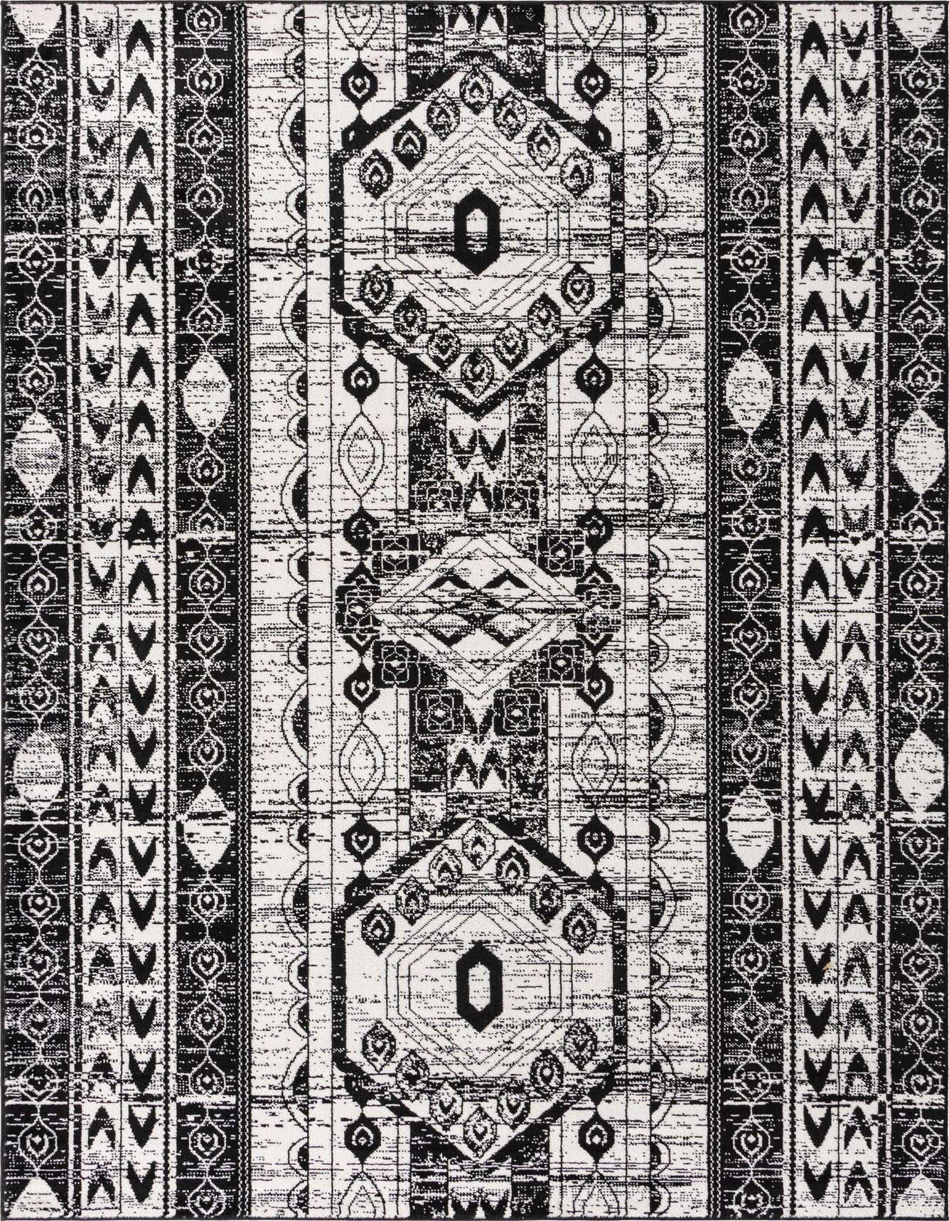 A 6x9 rectangular black and white bohemian rug with tribal and striped patterns, featuring a textured pile.