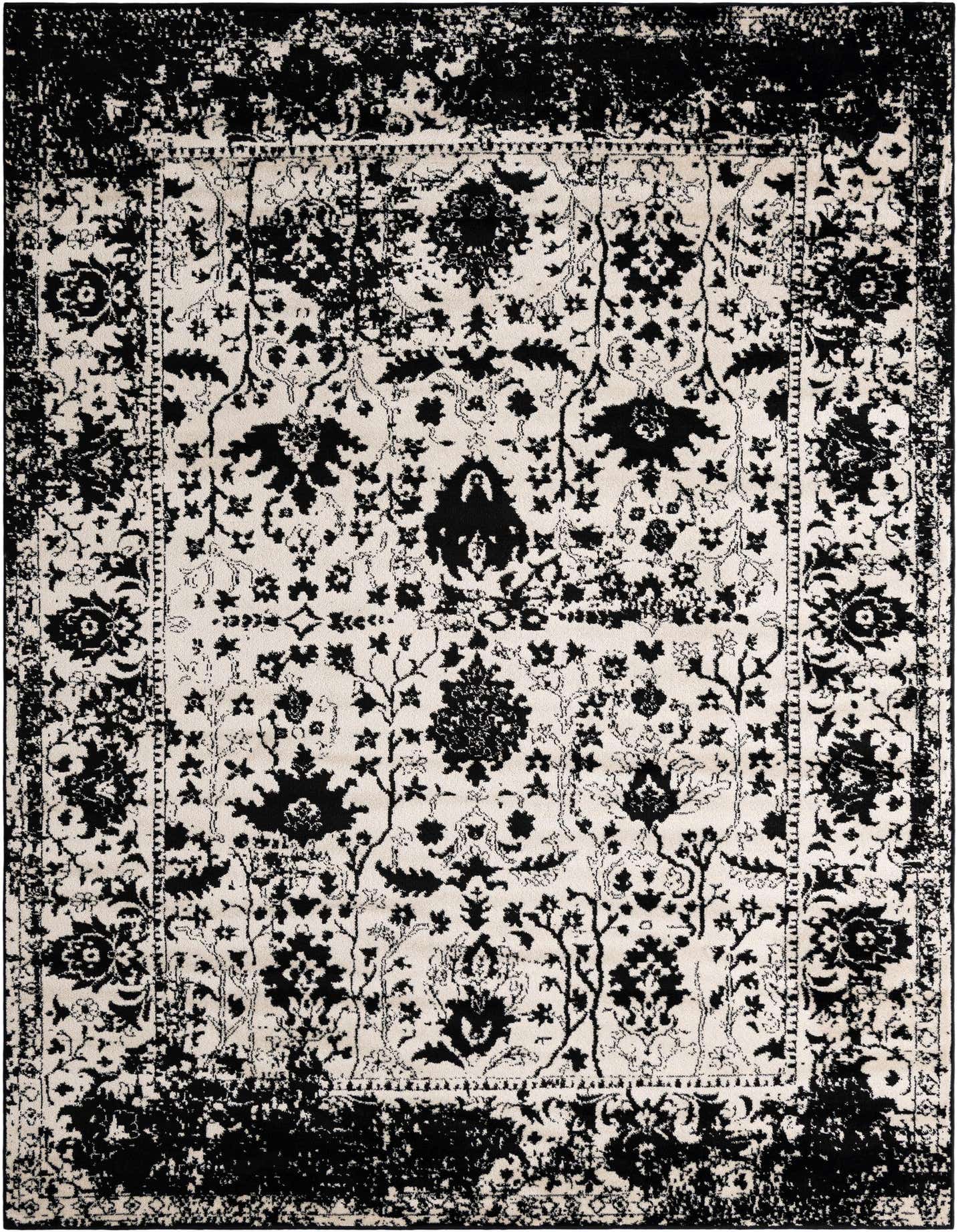 An 8x11 rectangular black and white shabby-chic rug with a distressed traditional floral pattern, ideal for a living room.