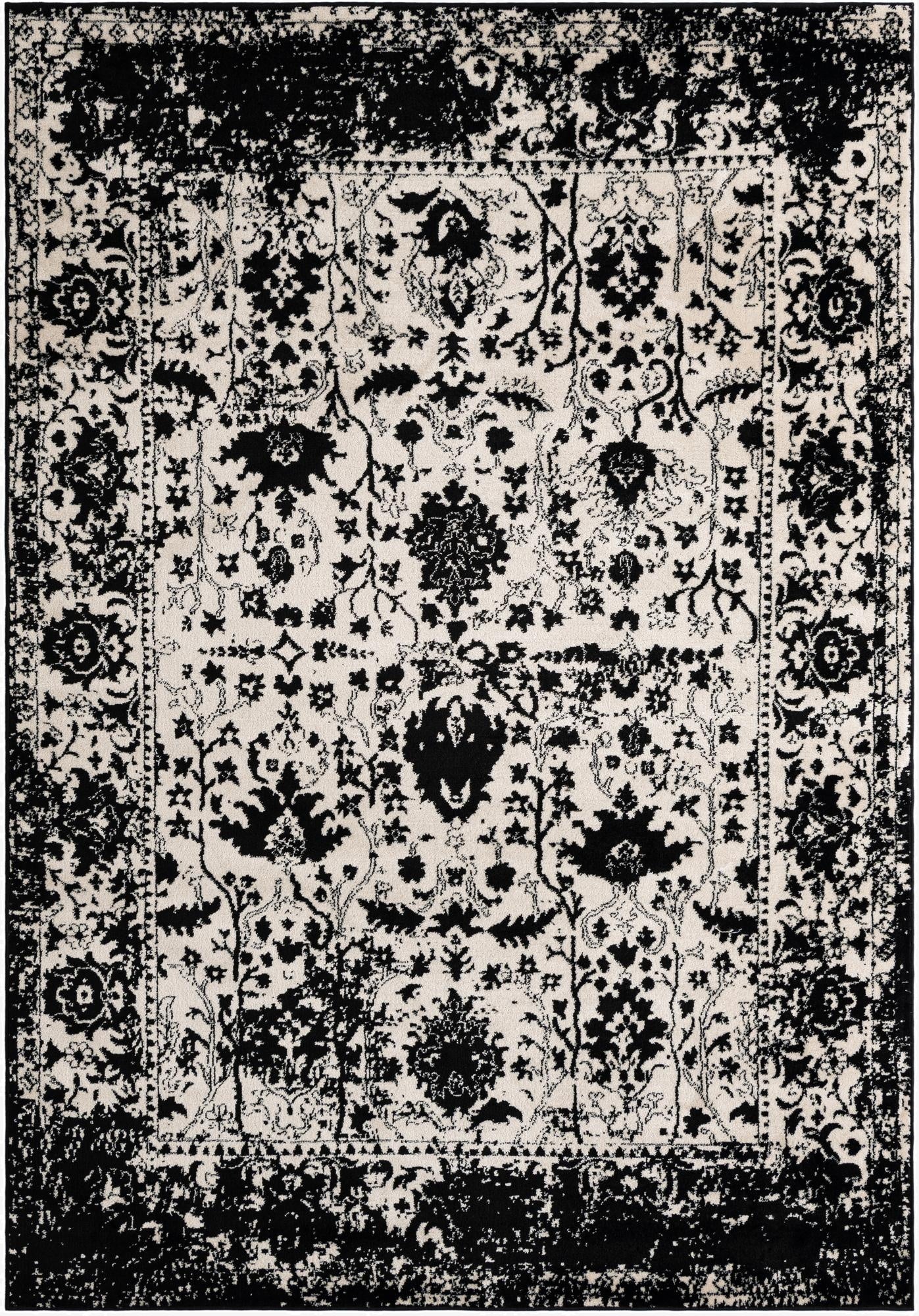 A 7x10 rectangular black and white shabby-chic rug with a distressed traditional floral pattern, ideal for a living room.
