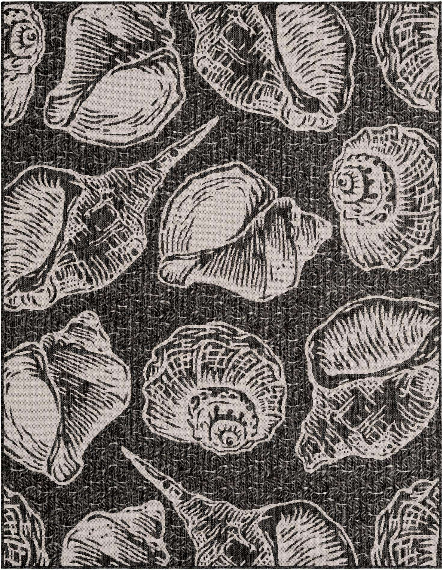 A 5x7 rectangular black and white coastal rug featuring various seashell patterns, suitable for indoor or outdoor use.