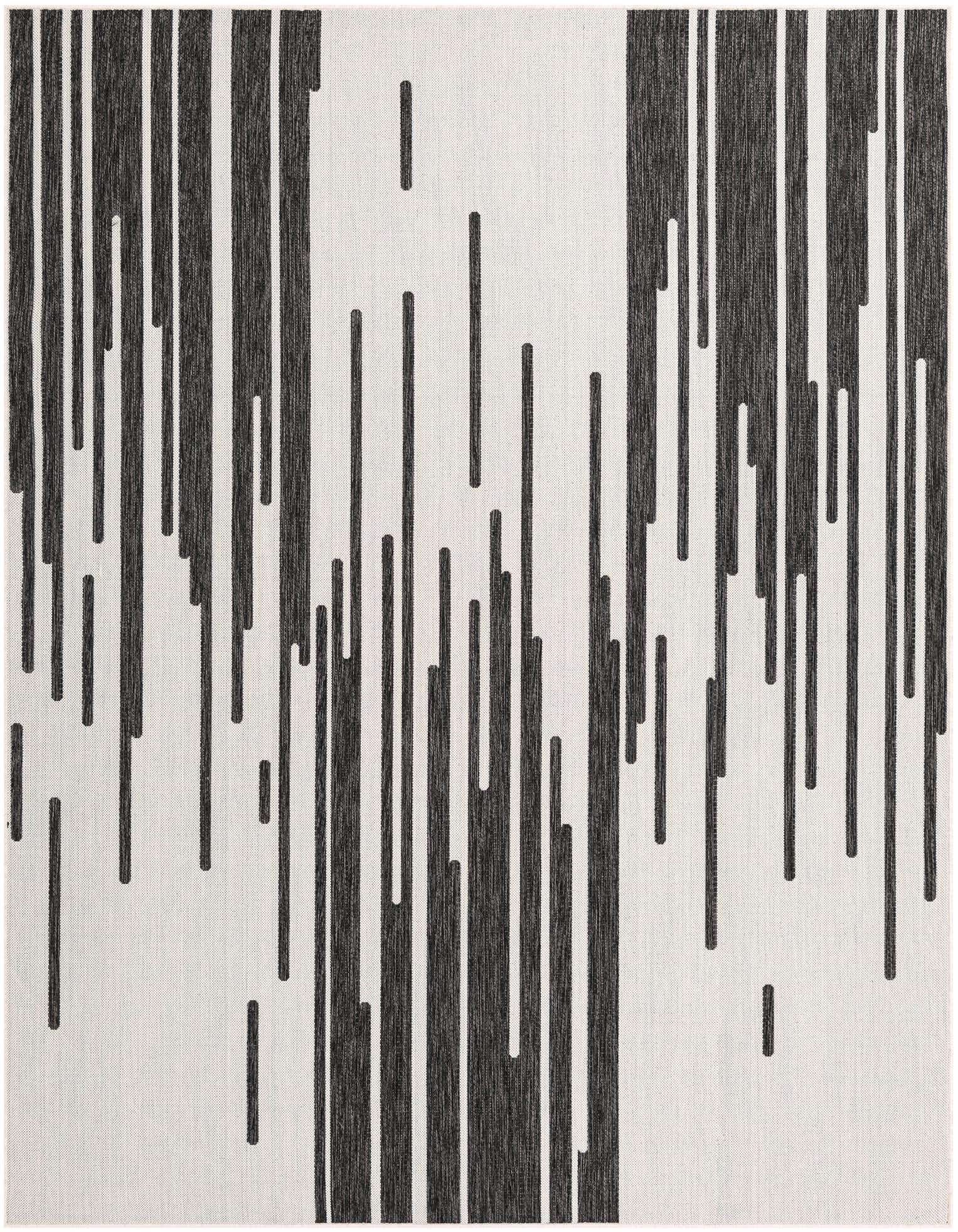 An 8x10 rectangular black and white modern rug with a dynamic vertical stripe pattern, suitable for indoor or outdoor use.