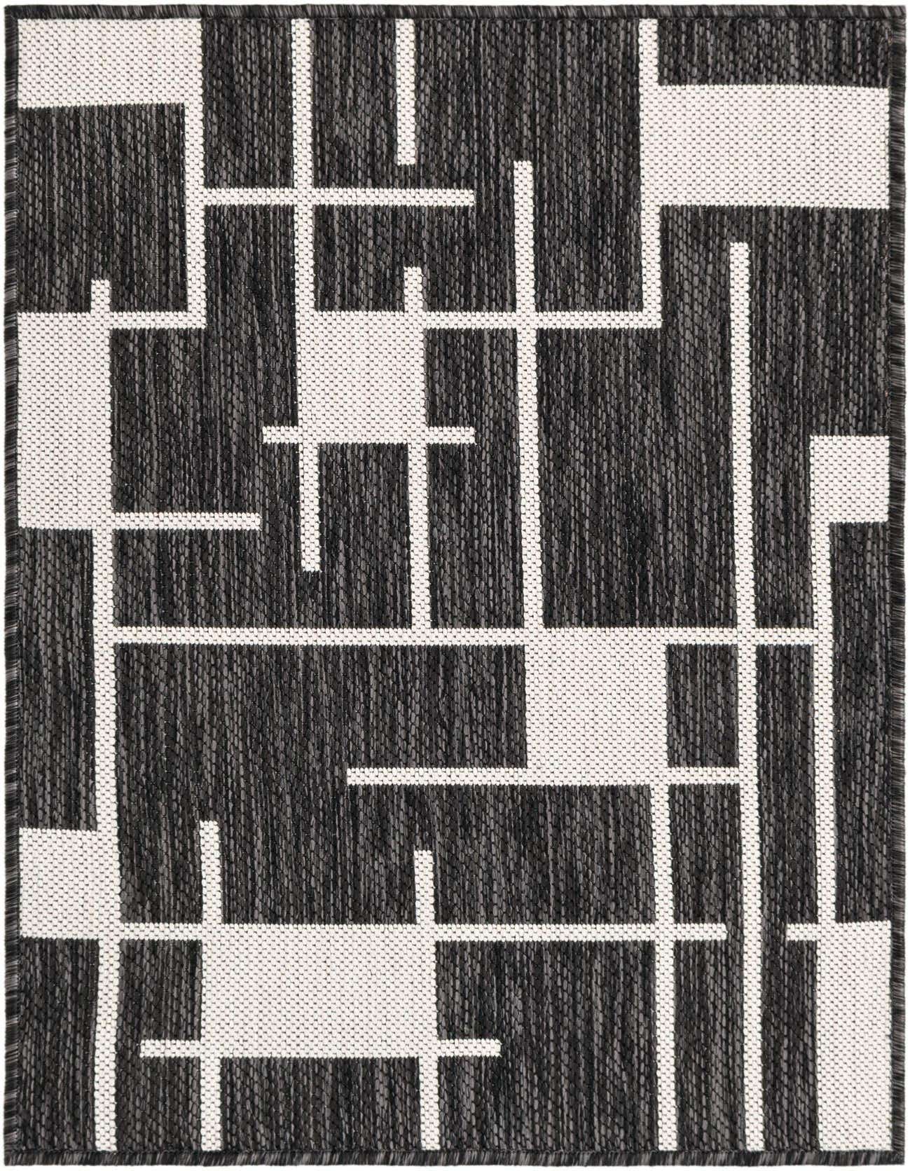 A 2x3 rectangular black and white contemporary flatweave rug with a bold geometric stripe pattern, suitable for indoor or outdoor use.