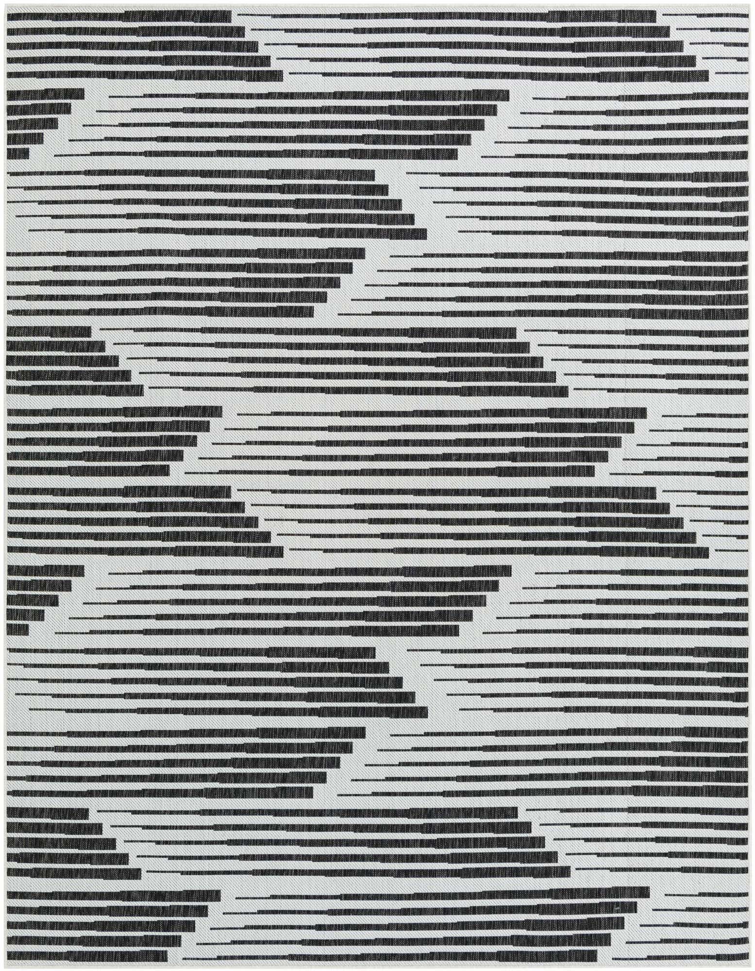 A rectangular 8x10 black and white modern rug with a dynamic striped pattern, suitable for indoor or outdoor use.