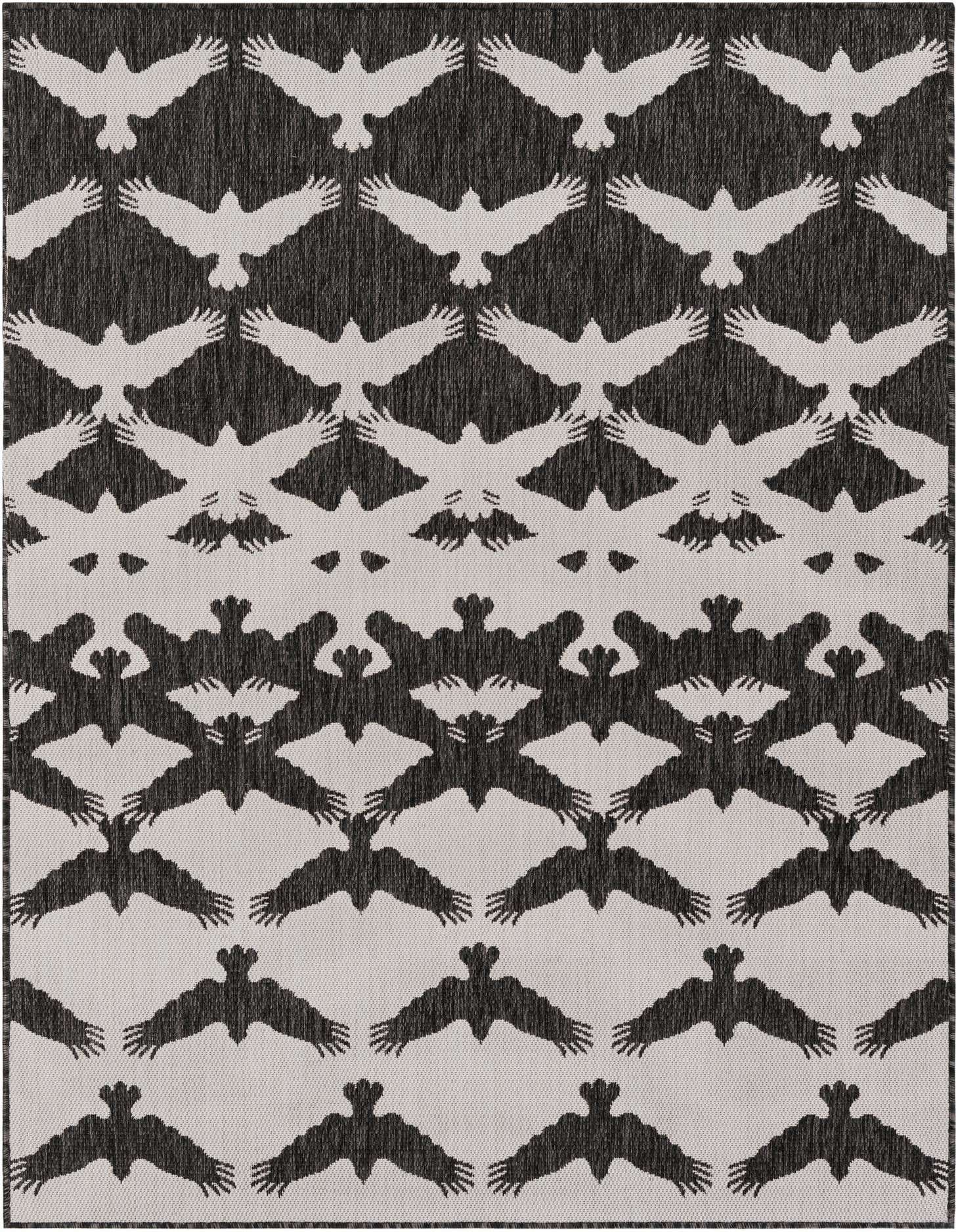 A 5x7 rectangular black and white modern rug featuring an interlocking pattern of white birds flying against a black background.