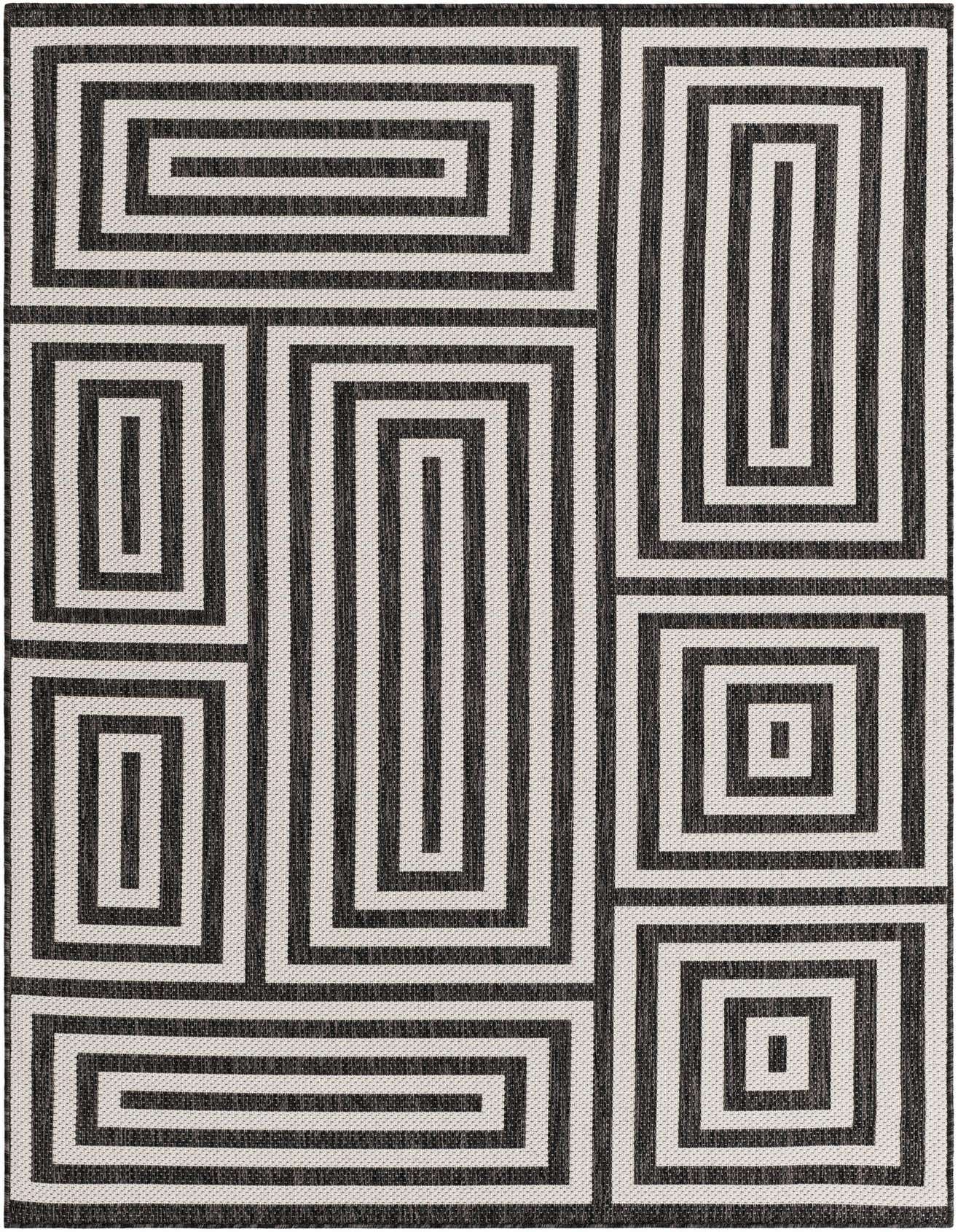 A 5x8 rectangular black and white modern abstract rug with a bold geometric maze pattern, suitable for indoor or outdoor spaces.