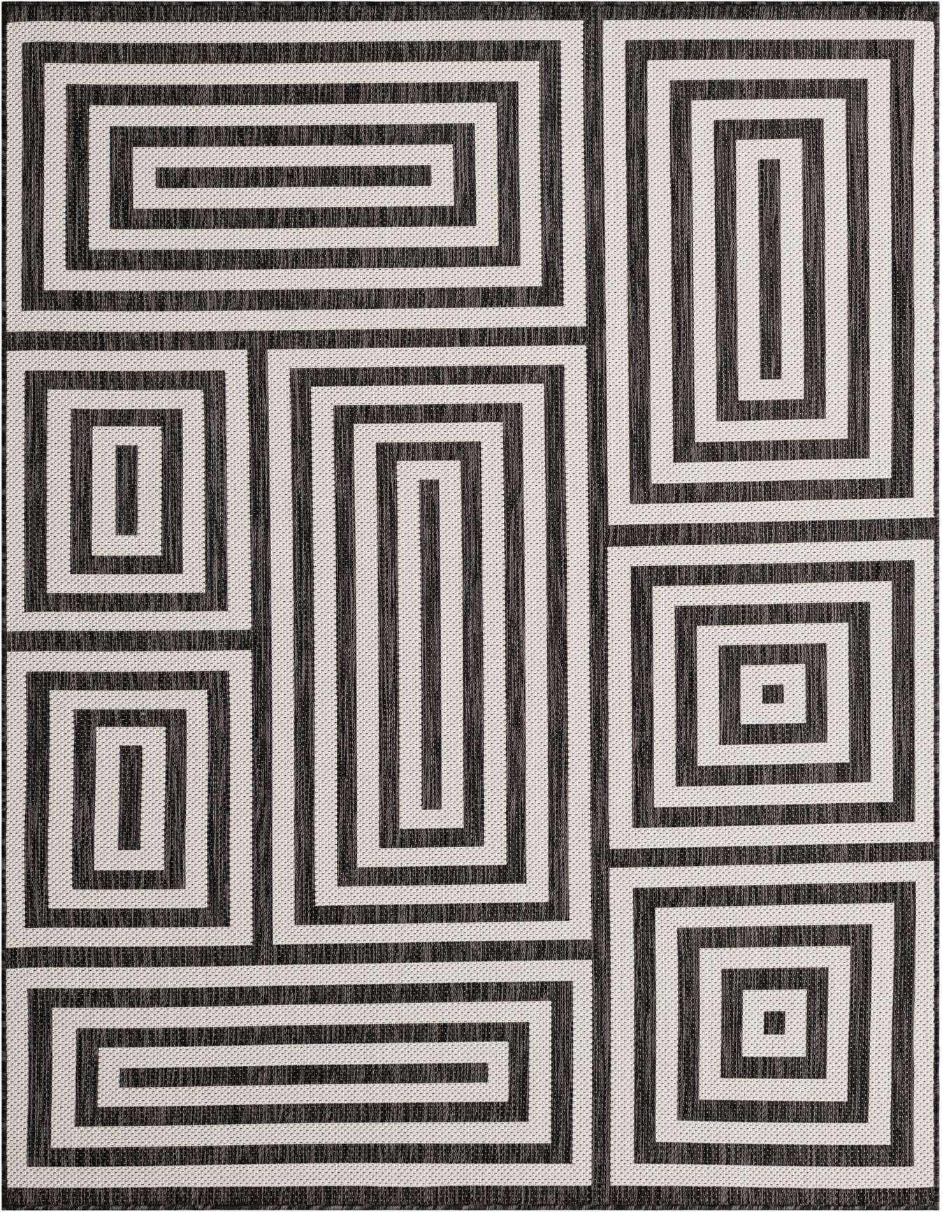 A 6x9 rectangular indoor/outdoor rug featuring a bold black and white abstract geometric pattern of interlocking rectangles.