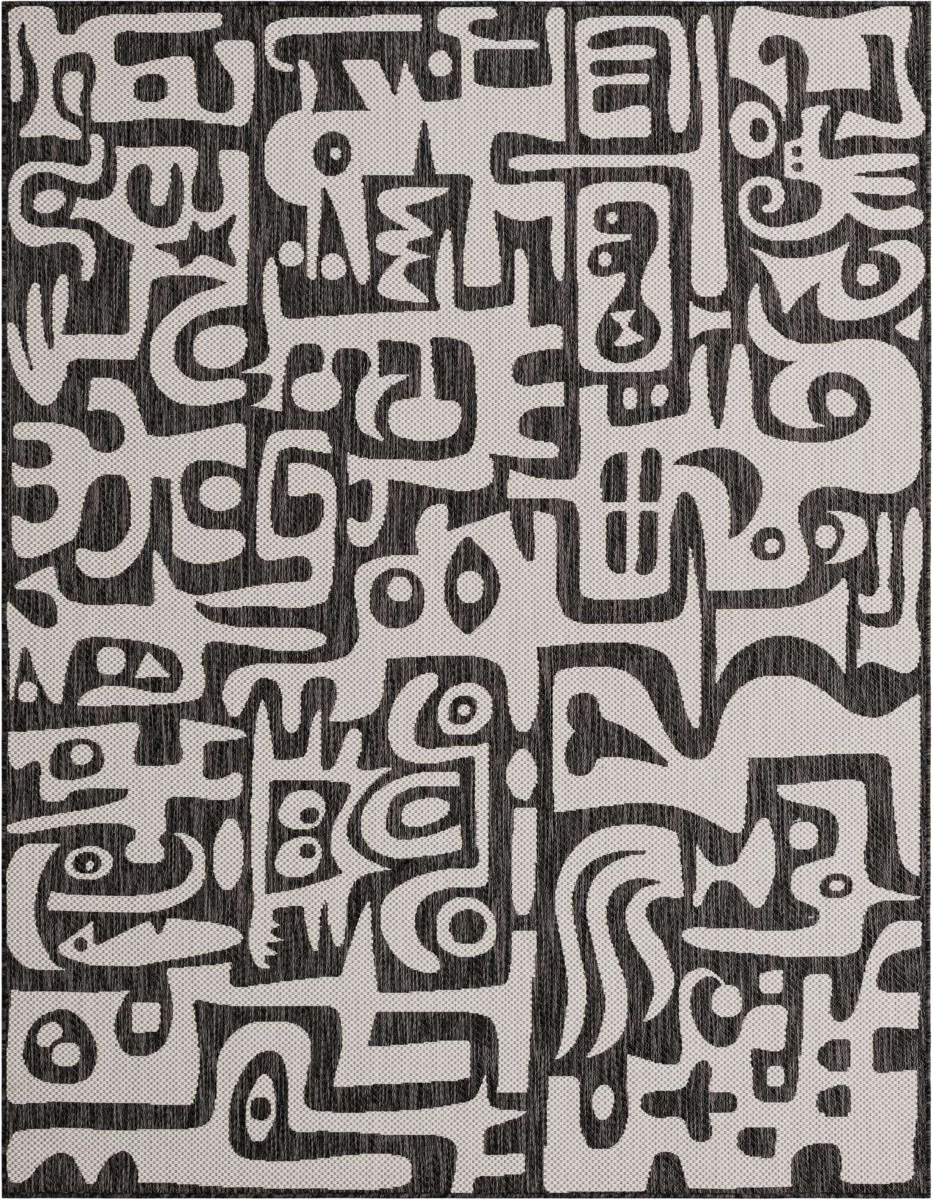 A 6x9 rectangular indoor/outdoor rug featuring a bold black and white abstract modern pattern, ideal for a living room or patio.