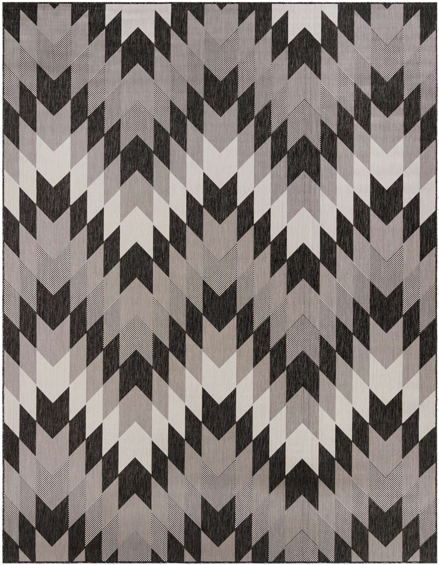 A 9x12 rectangular rug with a modern tribal pattern in black, dark gray, light gray, and cream chevron stripes.