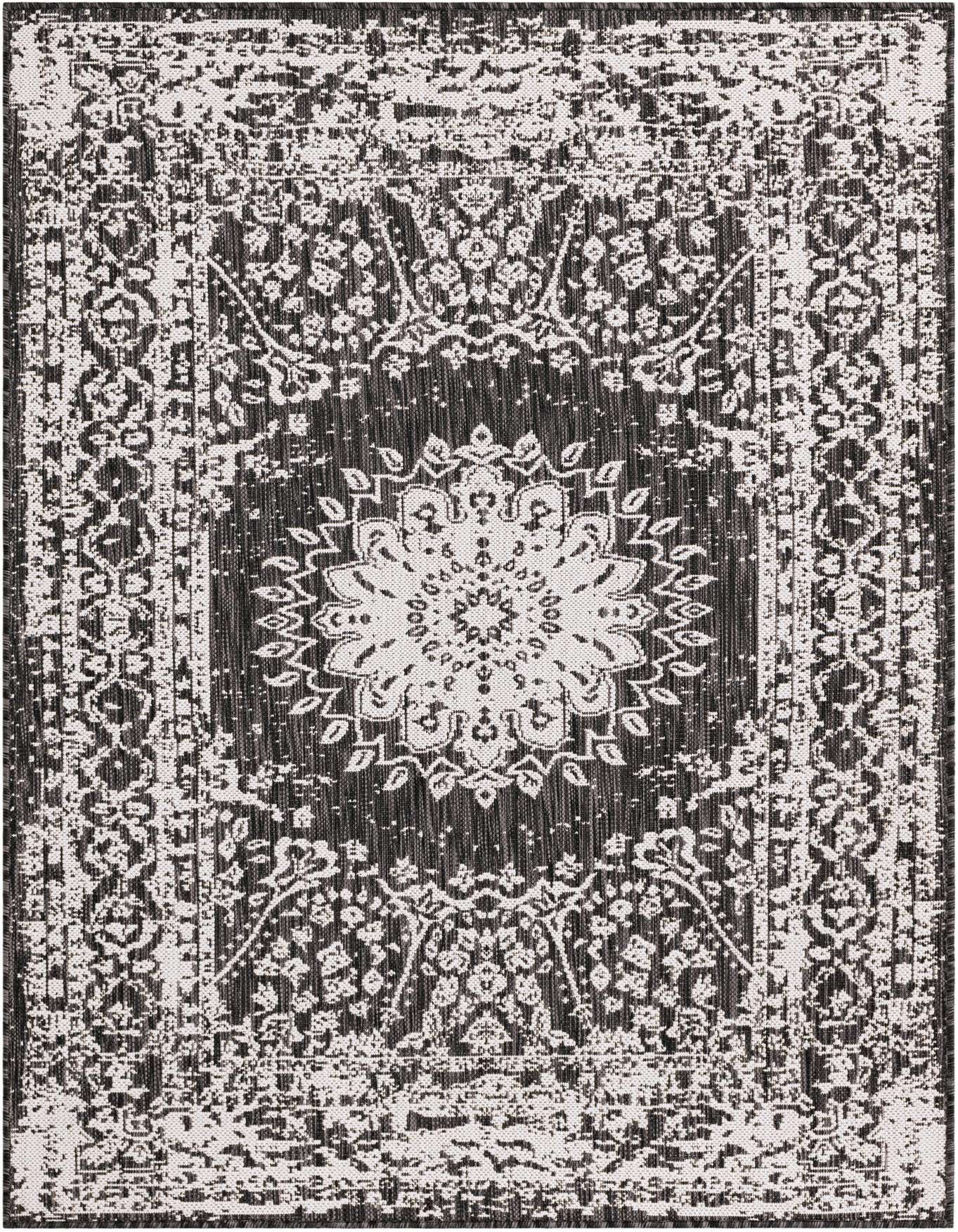 A 4x6 rectangular black and white indoor/outdoor rug with a distressed traditional medallion pattern, ideal for a patio or living room.