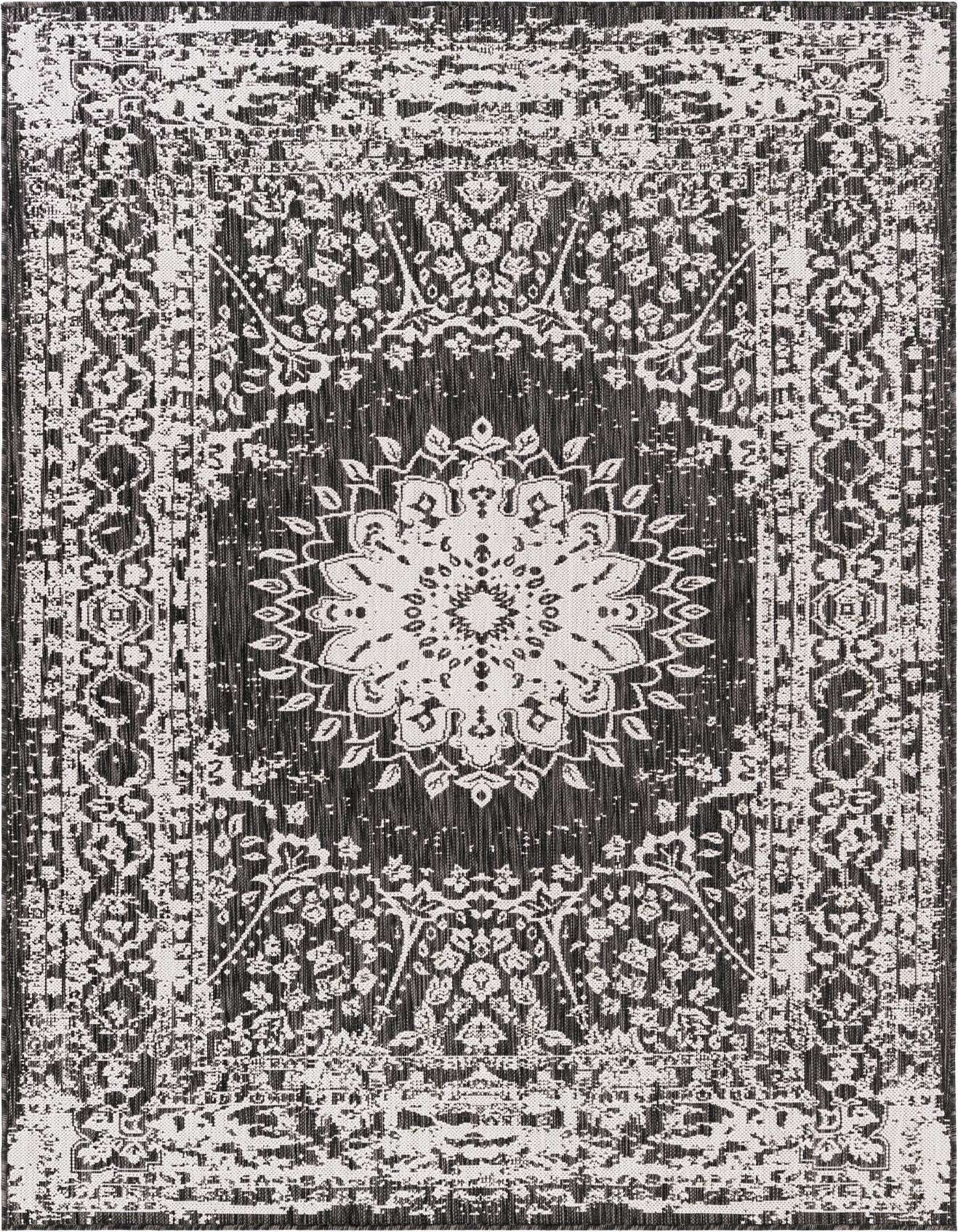 A 5x8 rectangular black and white outdoor rug featuring a distressed traditional medallion and floral pattern.