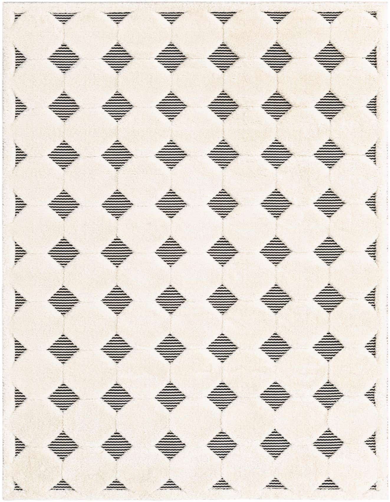 A 5x8 rectangular black and white area rug with a textured geometric pattern of raised ivory circles and recessed black striped diamonds.