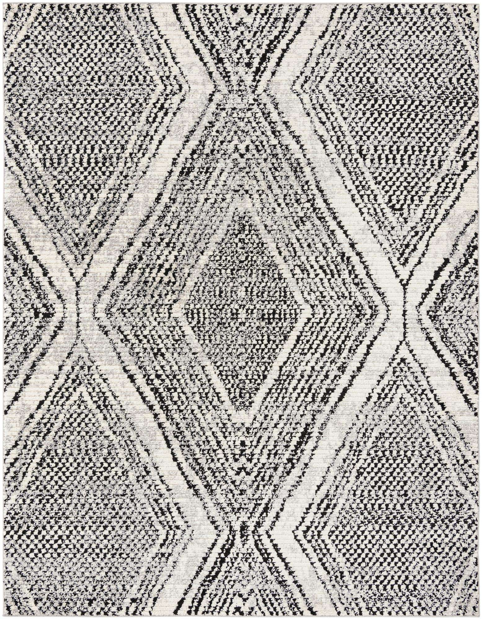 A rectangular 8x10 black and white Southwestern rug with a textured diamond and stripe pattern.