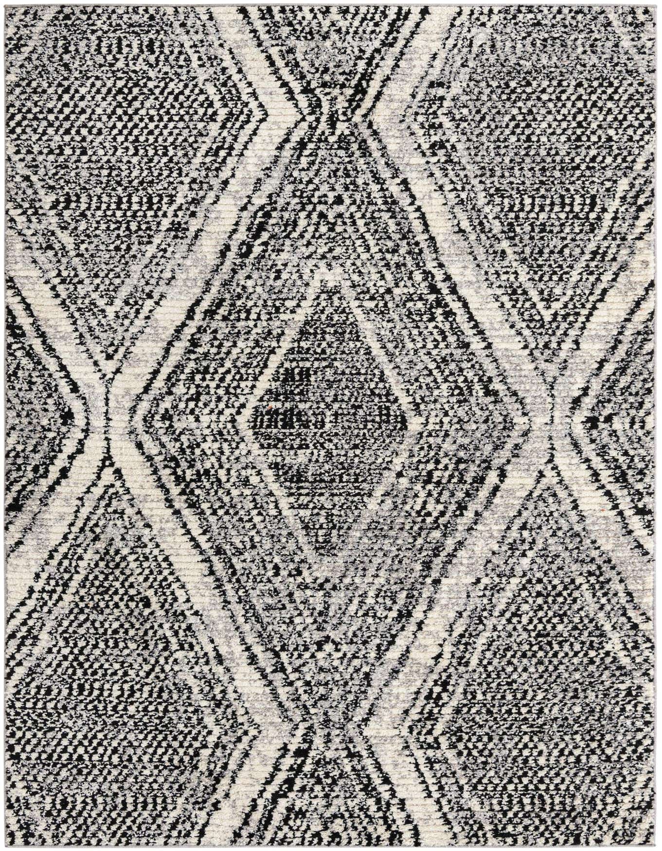 A 6x9 rectangular Tagine rug featuring a bold black and white Southwestern diamond pattern with a textured pile.