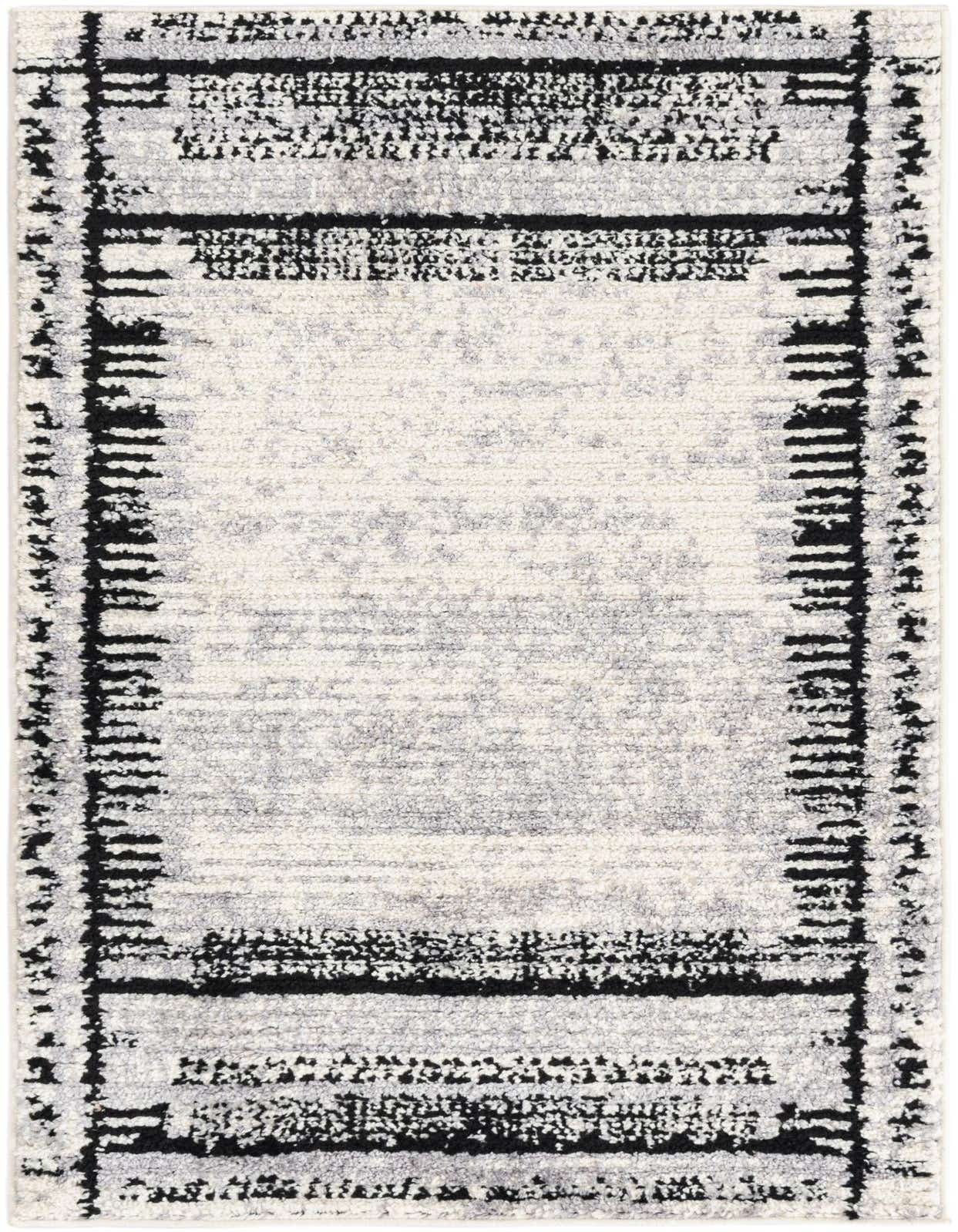 A 3x5 rectangular Tagine rug, featuring a modern abstract pattern in black and white with a textured pile.