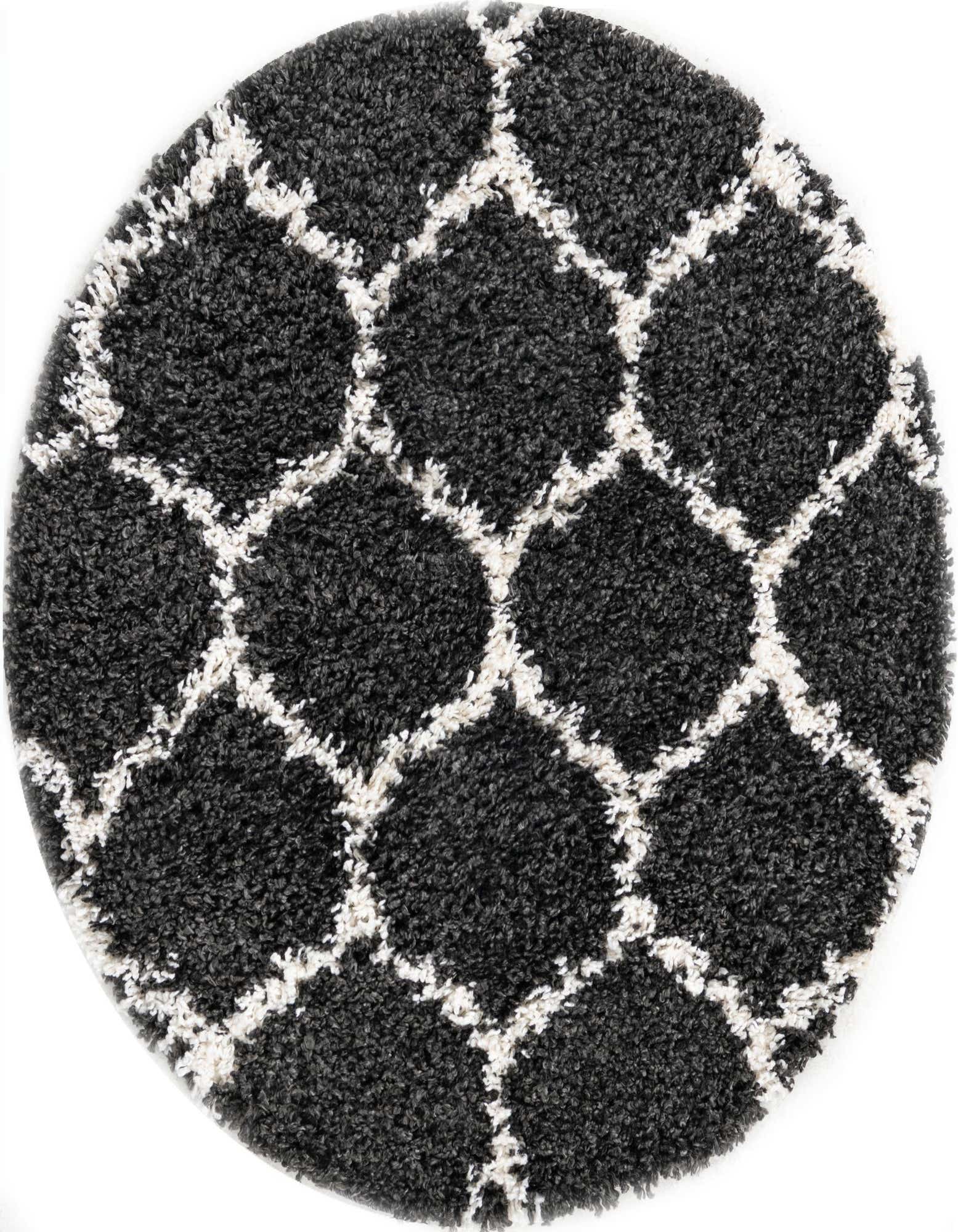 A round black shag rug with a white modern geometric trellis pattern, offering plush texture.