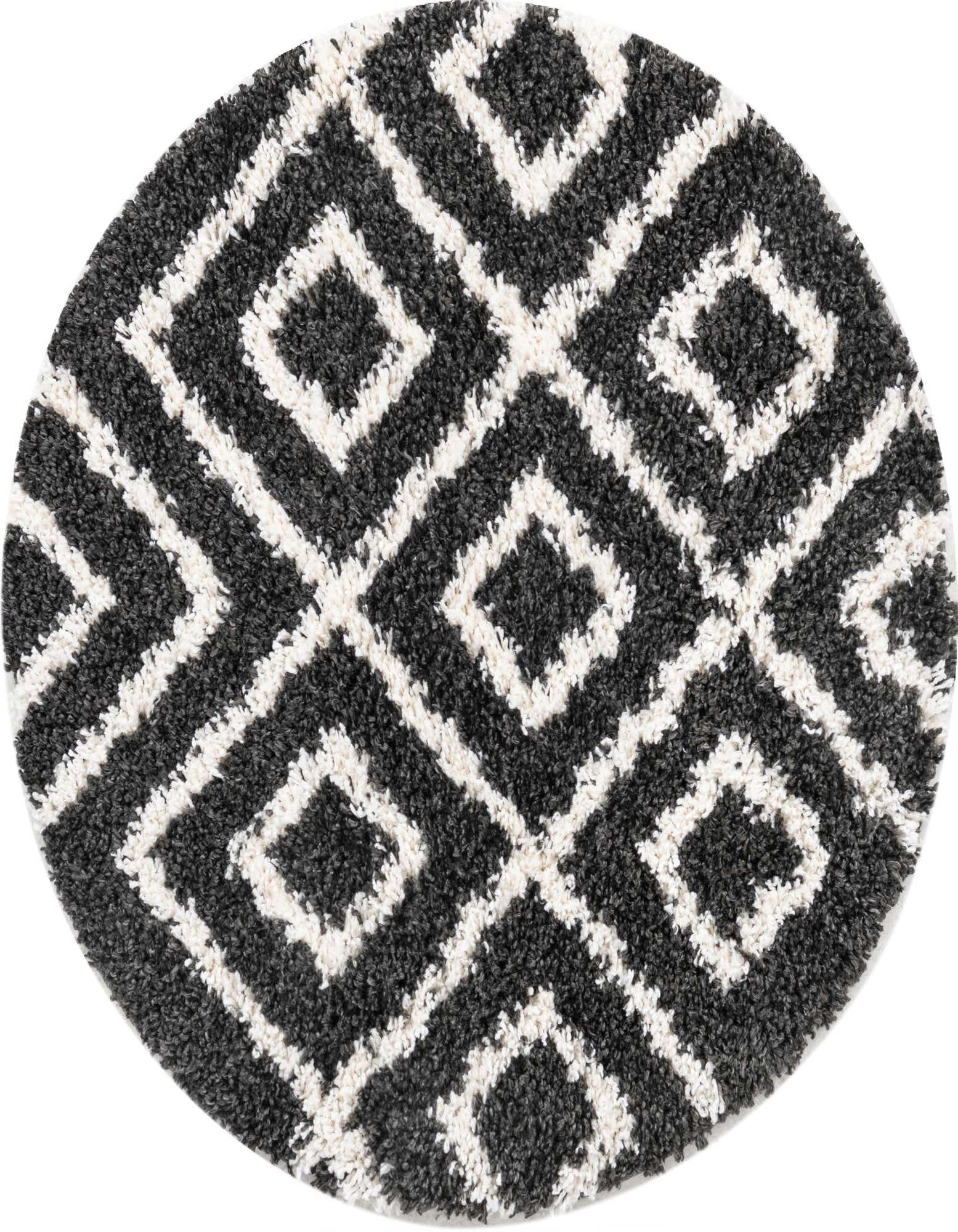 A round black and white shag rug with a modern geometric diamond pattern, ideal for a living room.