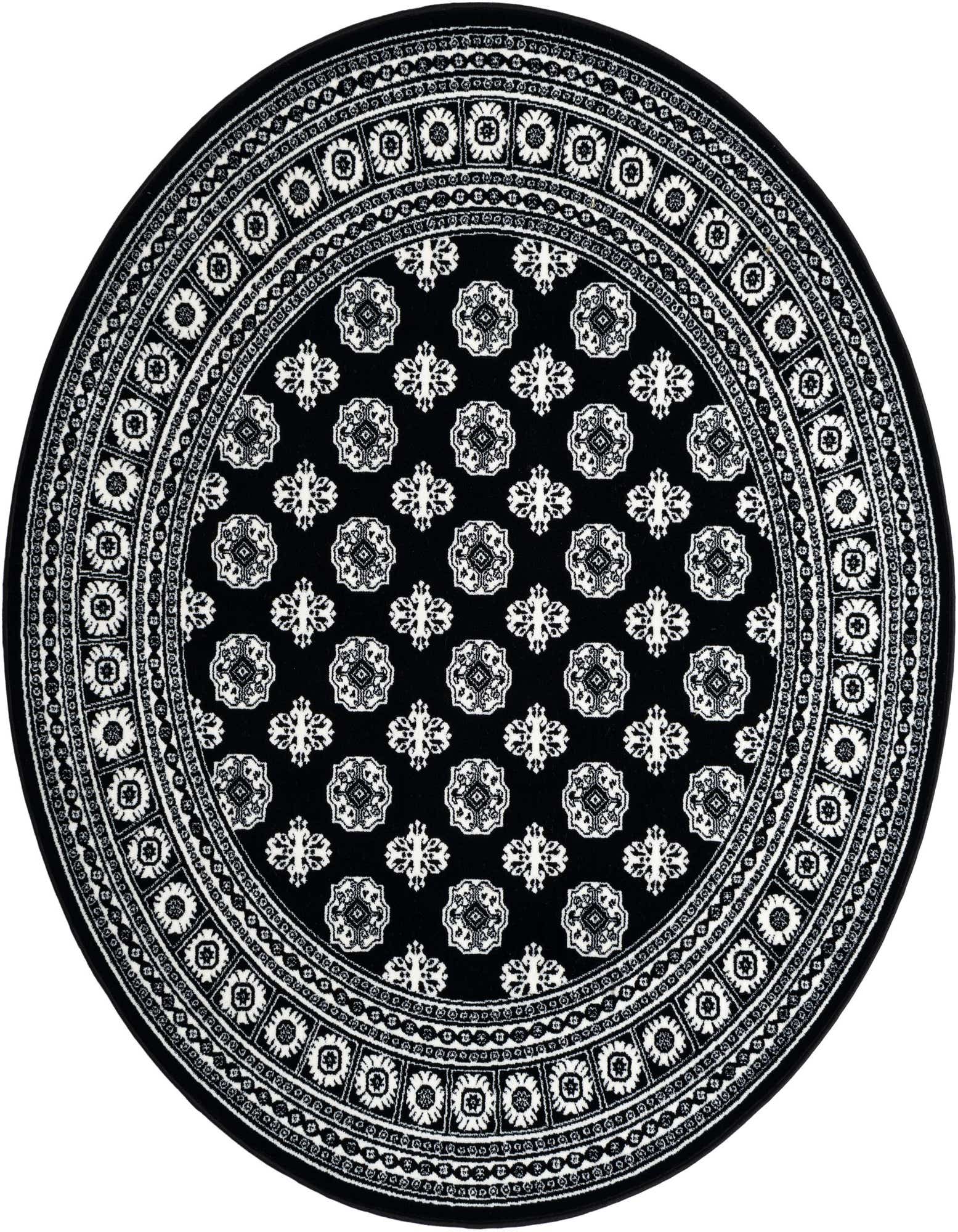A round 6' black rug with intricate white and ivory traditional patterns and a detailed border, suitable for a patio.