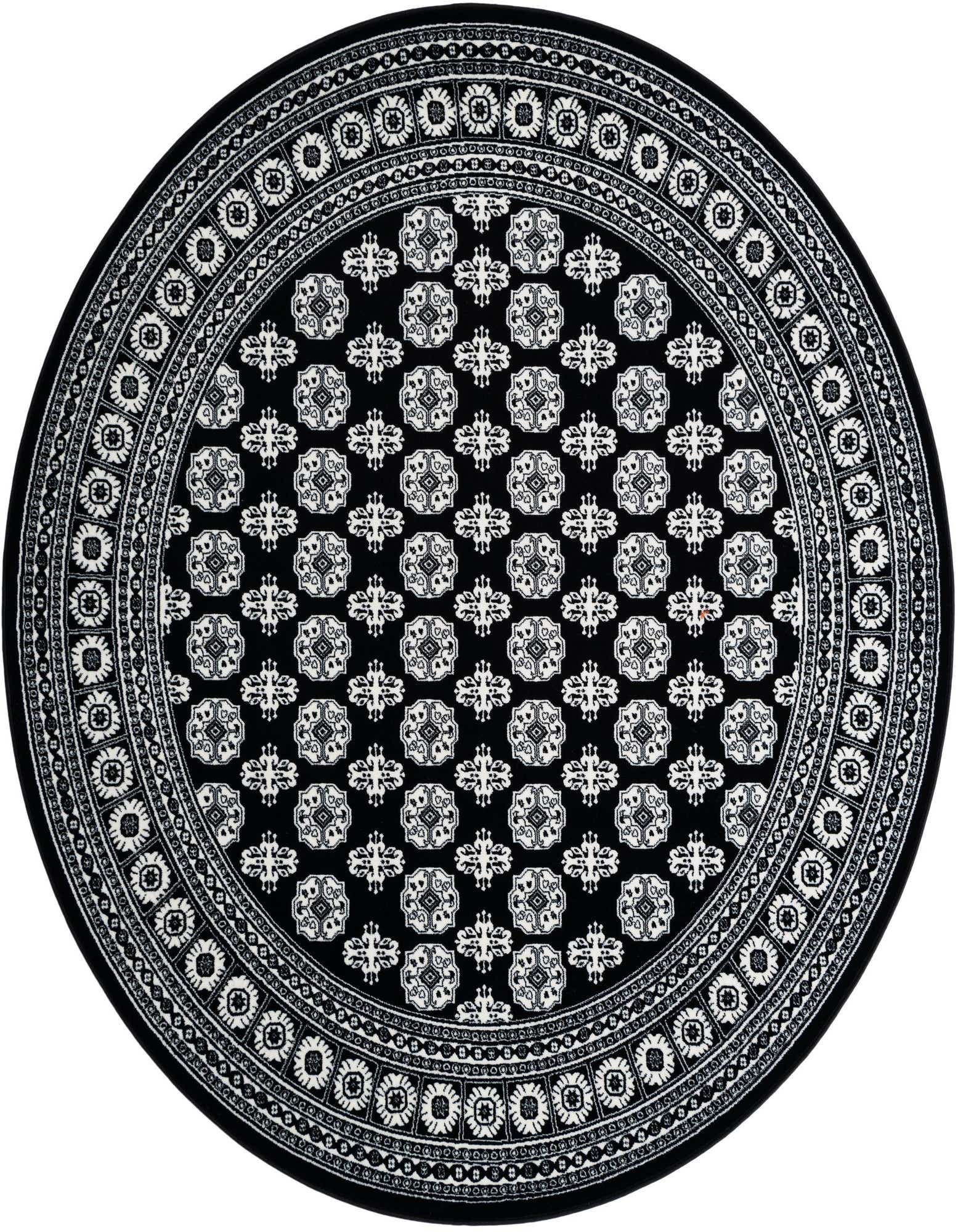 A 7' 10 round black and white Bokhara rug with intricate floral and geometric patterns, ideal for an indoor patio.