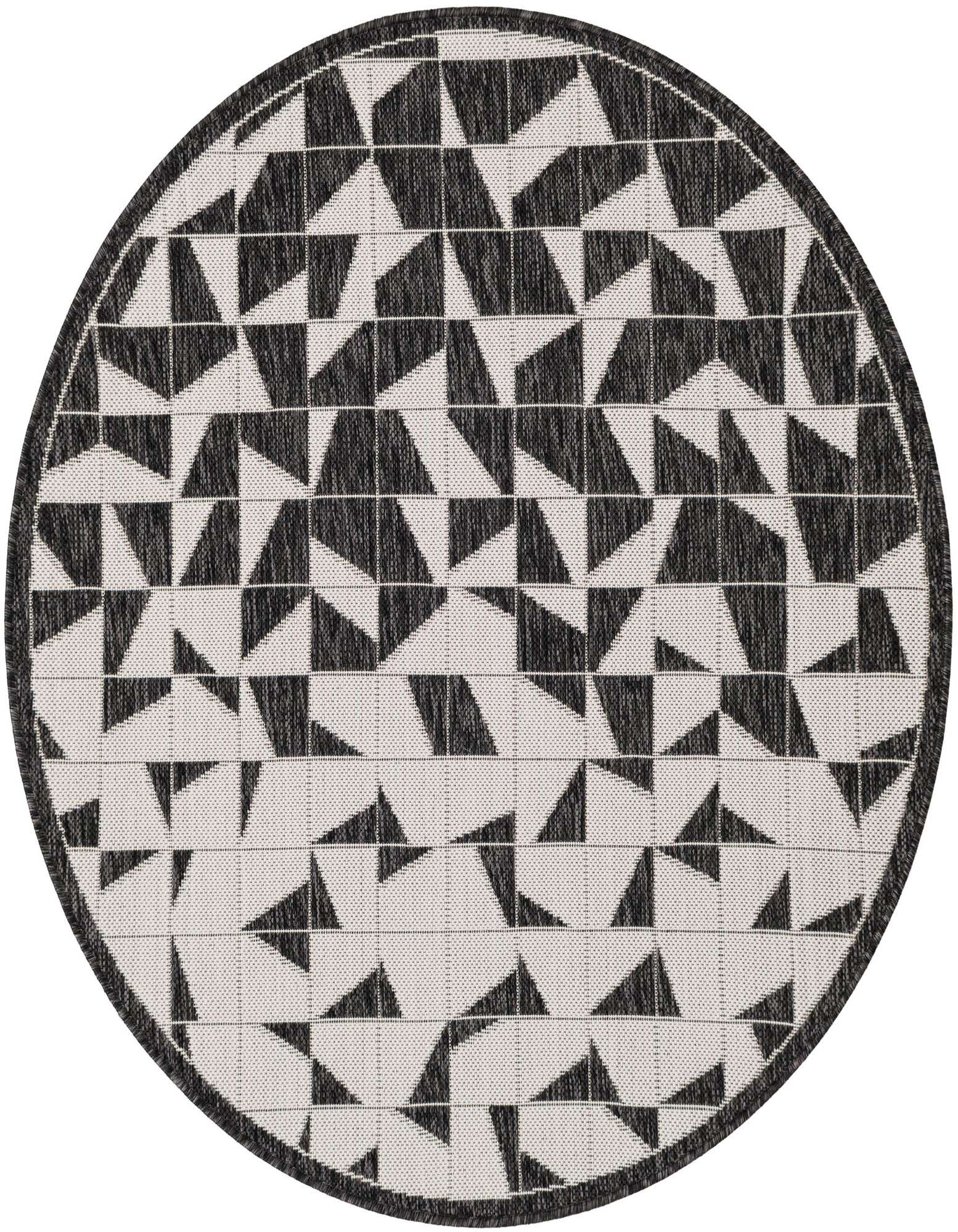 A 4' round black and white modern geometric outdoor rug with an abstract pattern and flatweave texture.