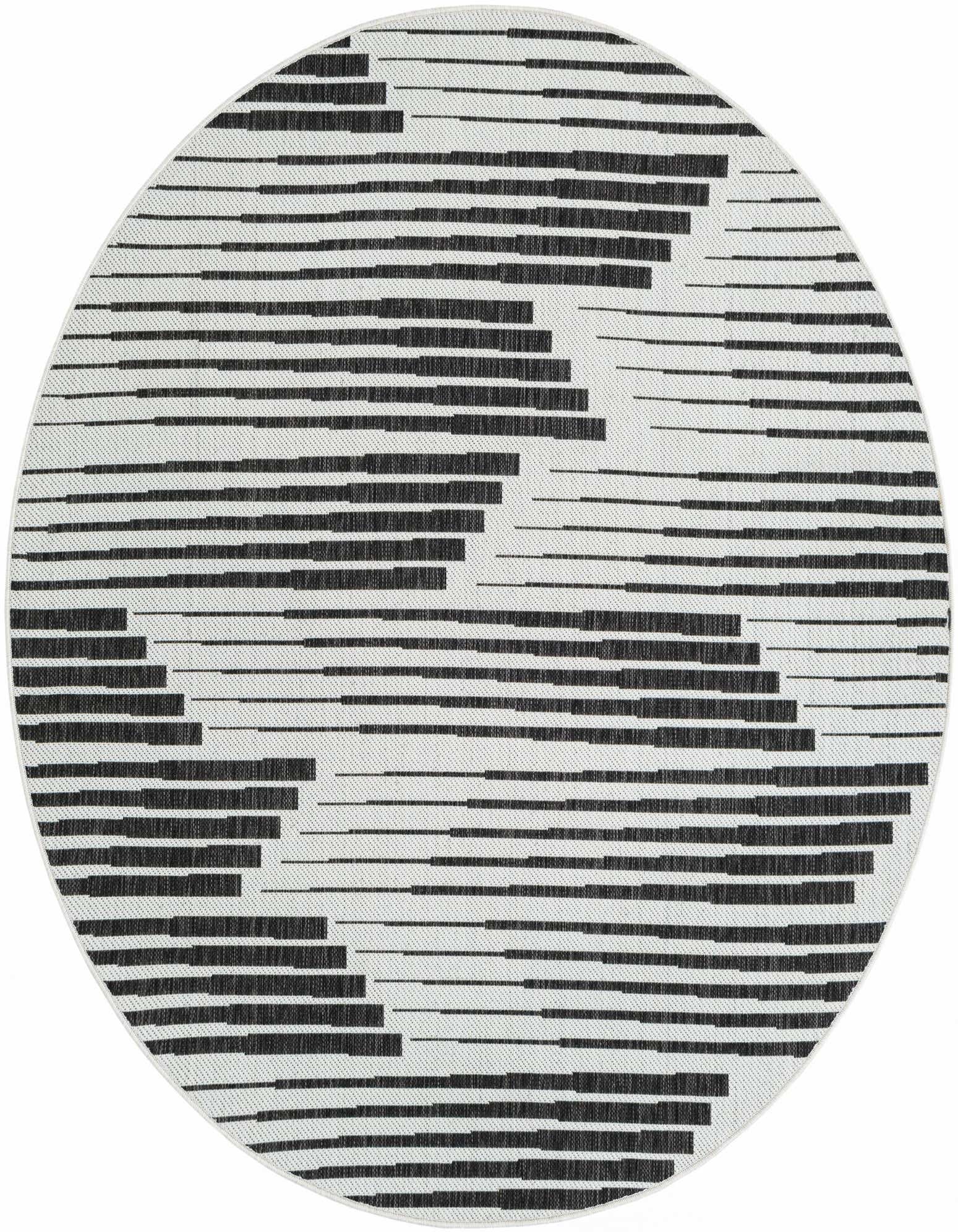 A round 6' 1 x 6' 1 black and white outdoor rug with a modern striped geometric pattern.