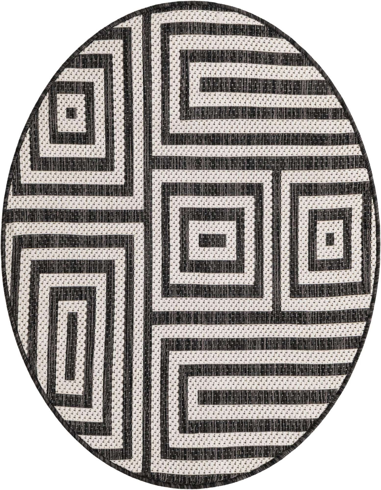 A round black and white modern rug with an abstract geometric pattern of interlocking squares and lines.