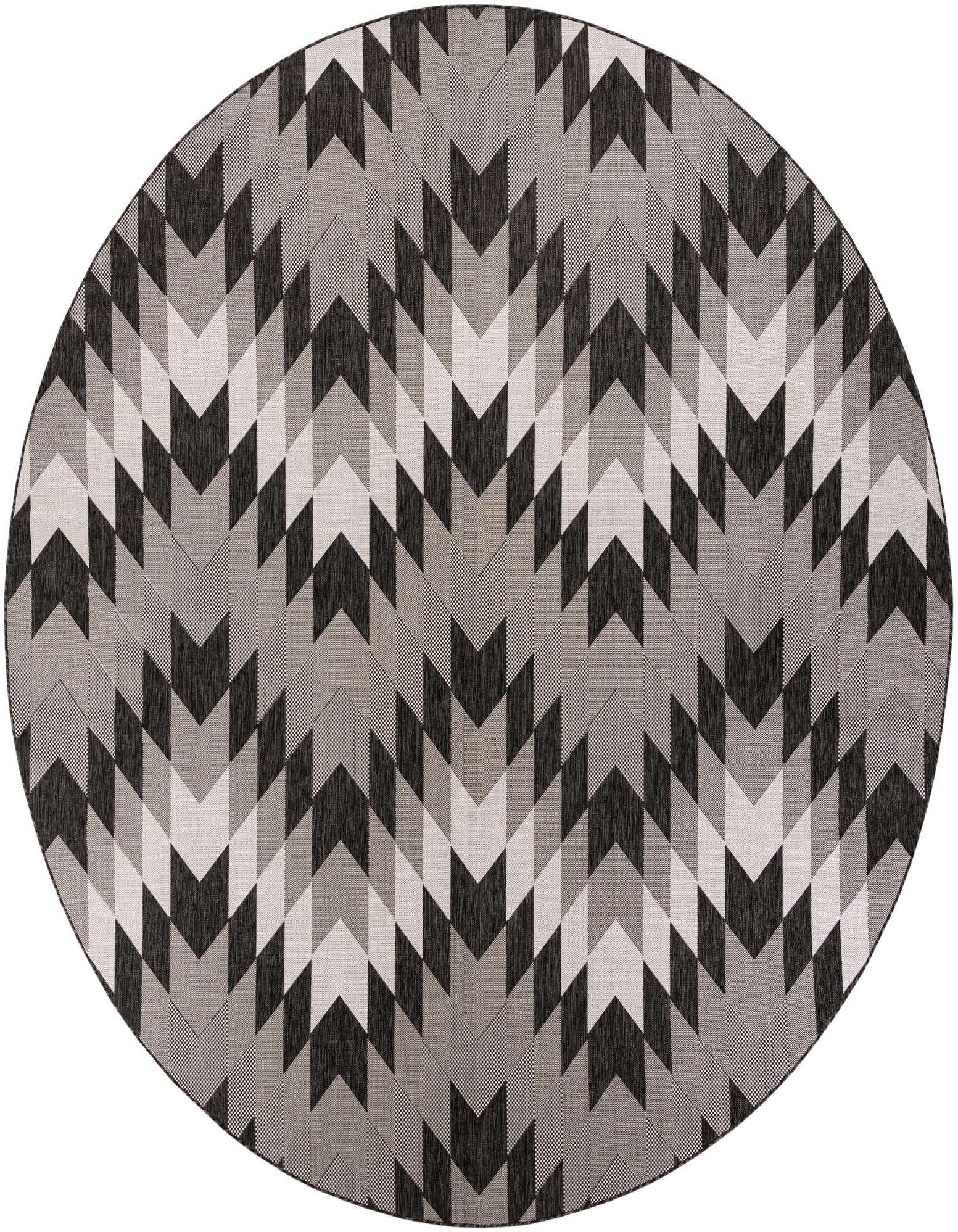 A 12' round black, white, and gray tribal geometric rug with a chevron pattern, suitable for a patio.