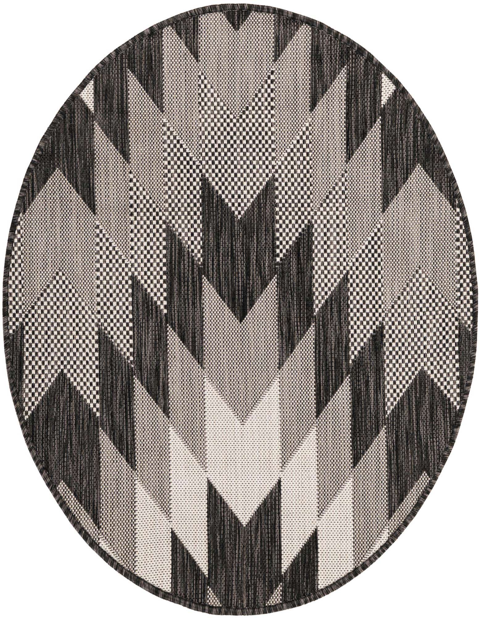 A 3' round black and white tribal pattern rug, featuring geometric chevron and striped designs, suitable for a patio.