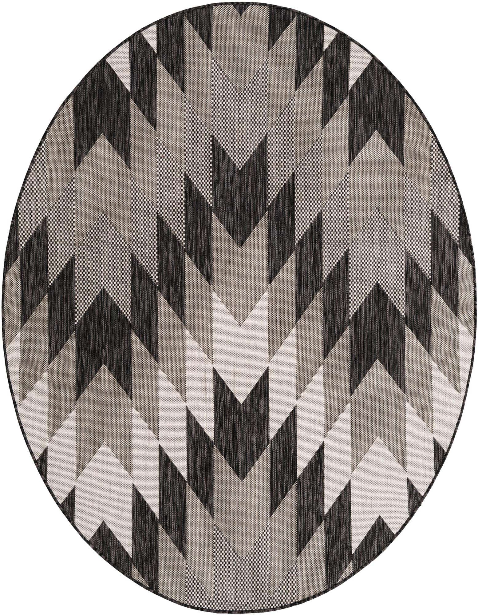 A 6' round black, white, and cream geometric tribal rug with a chevron pattern, suitable for indoor or outdoor use.