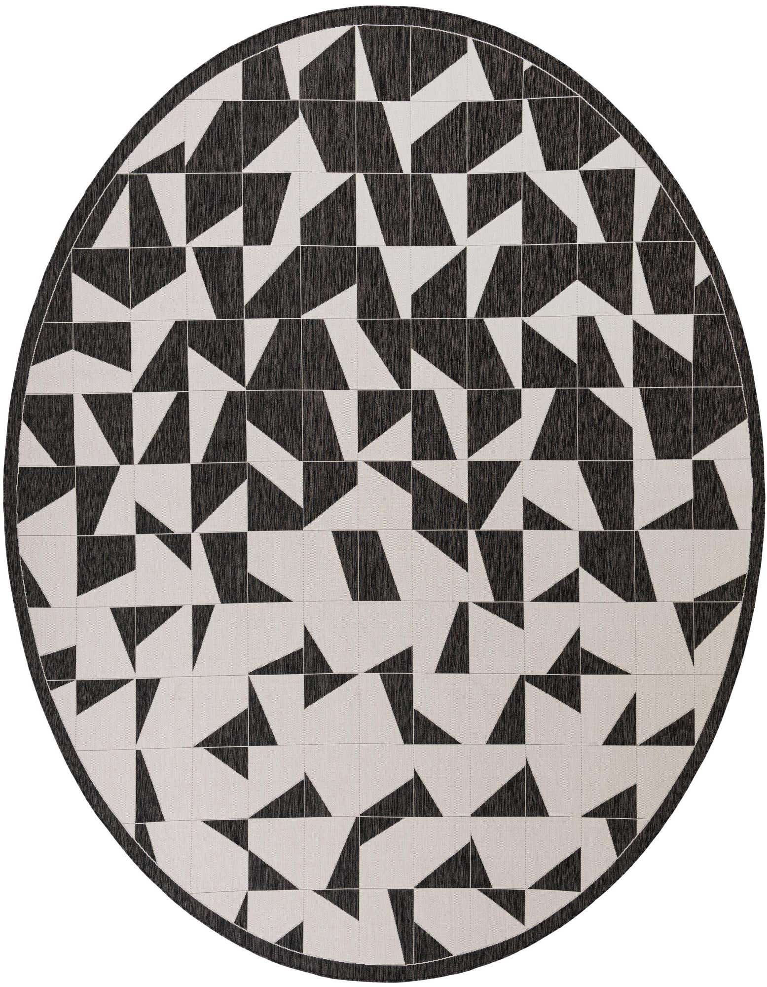 A large round black and white modern rug featuring a geometric pattern of alternating dark and light triangles.