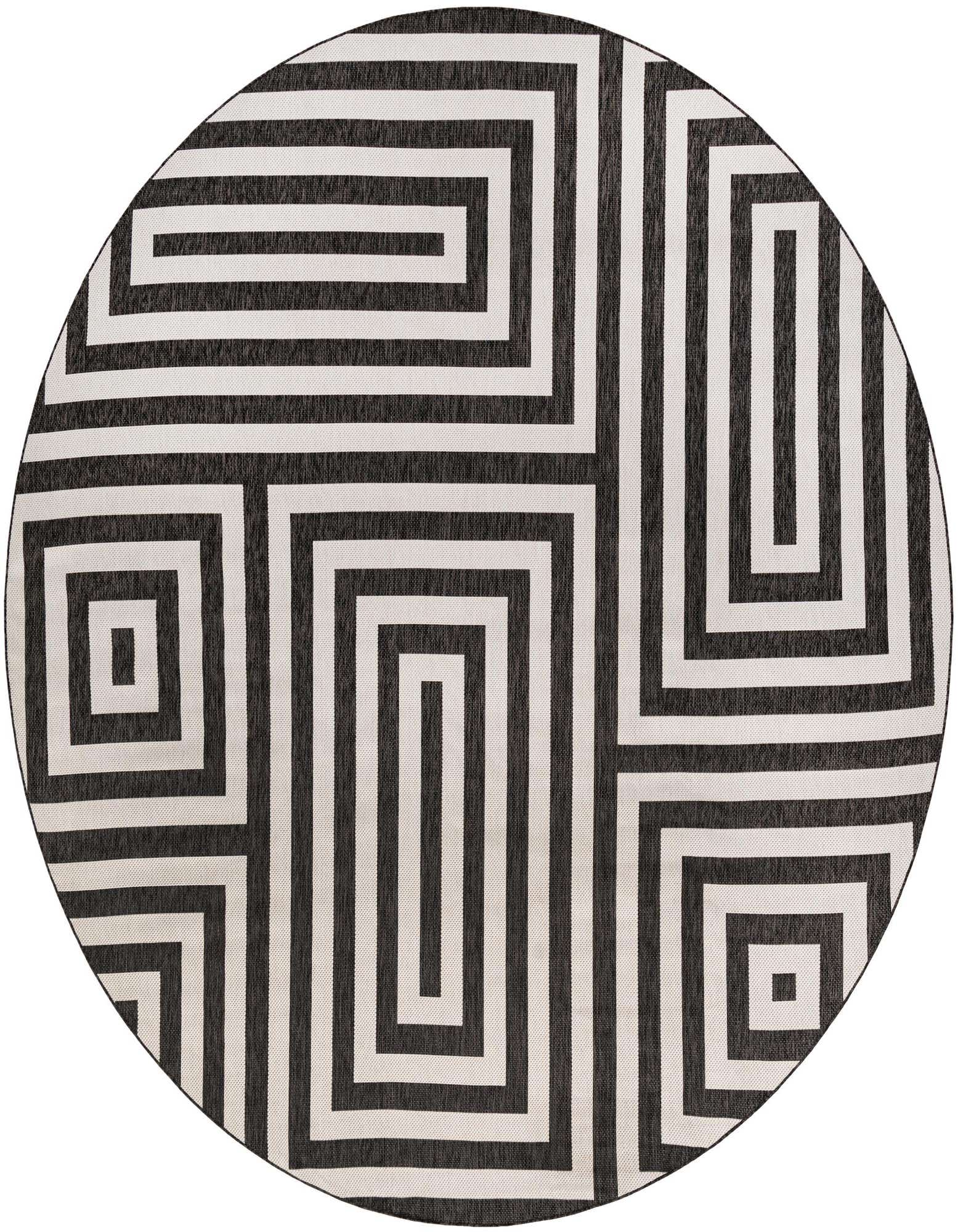 A large round black and white modern abstract rug with a maze-like geometric pattern, suitable for a patio.