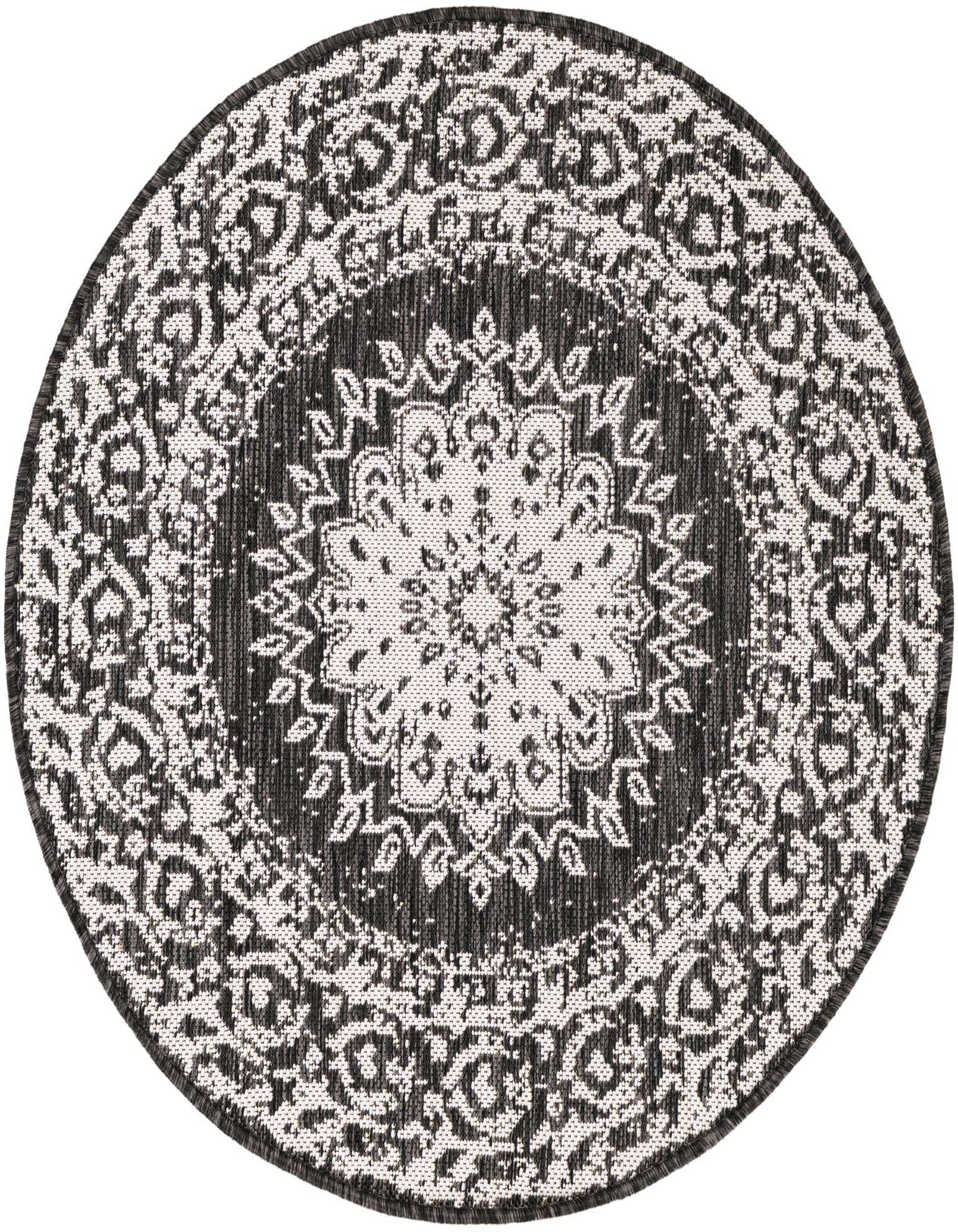 A round black and white medallion rug with intricate traditional patterns, suitable for indoor or outdoor use.