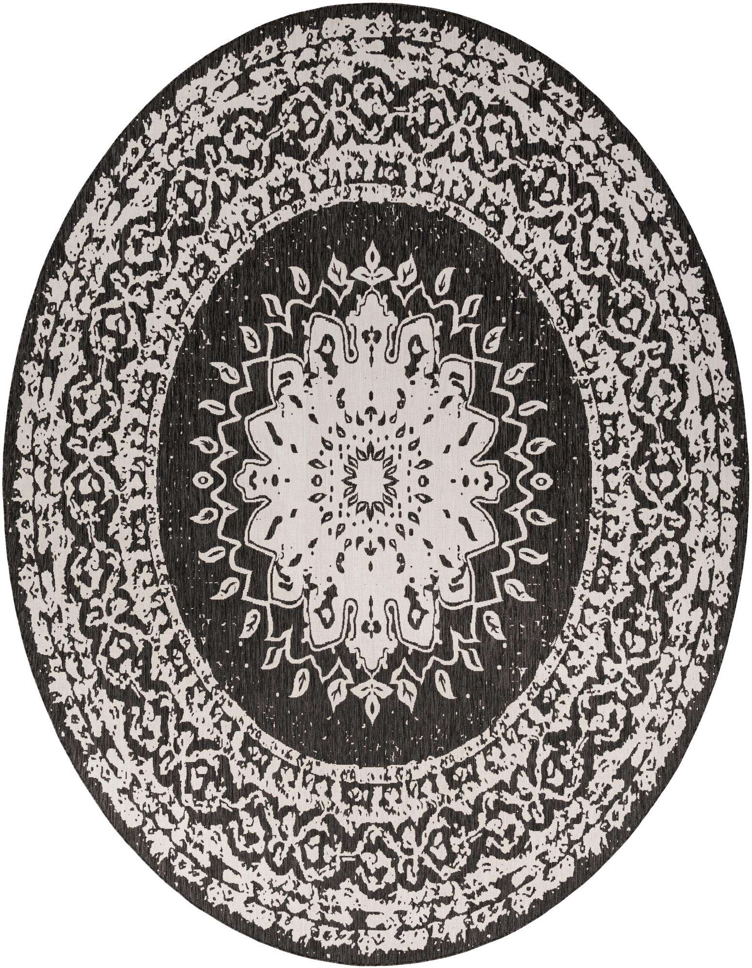 A large round black and white modern rug with an intricate medallion pattern, suitable for a patio.