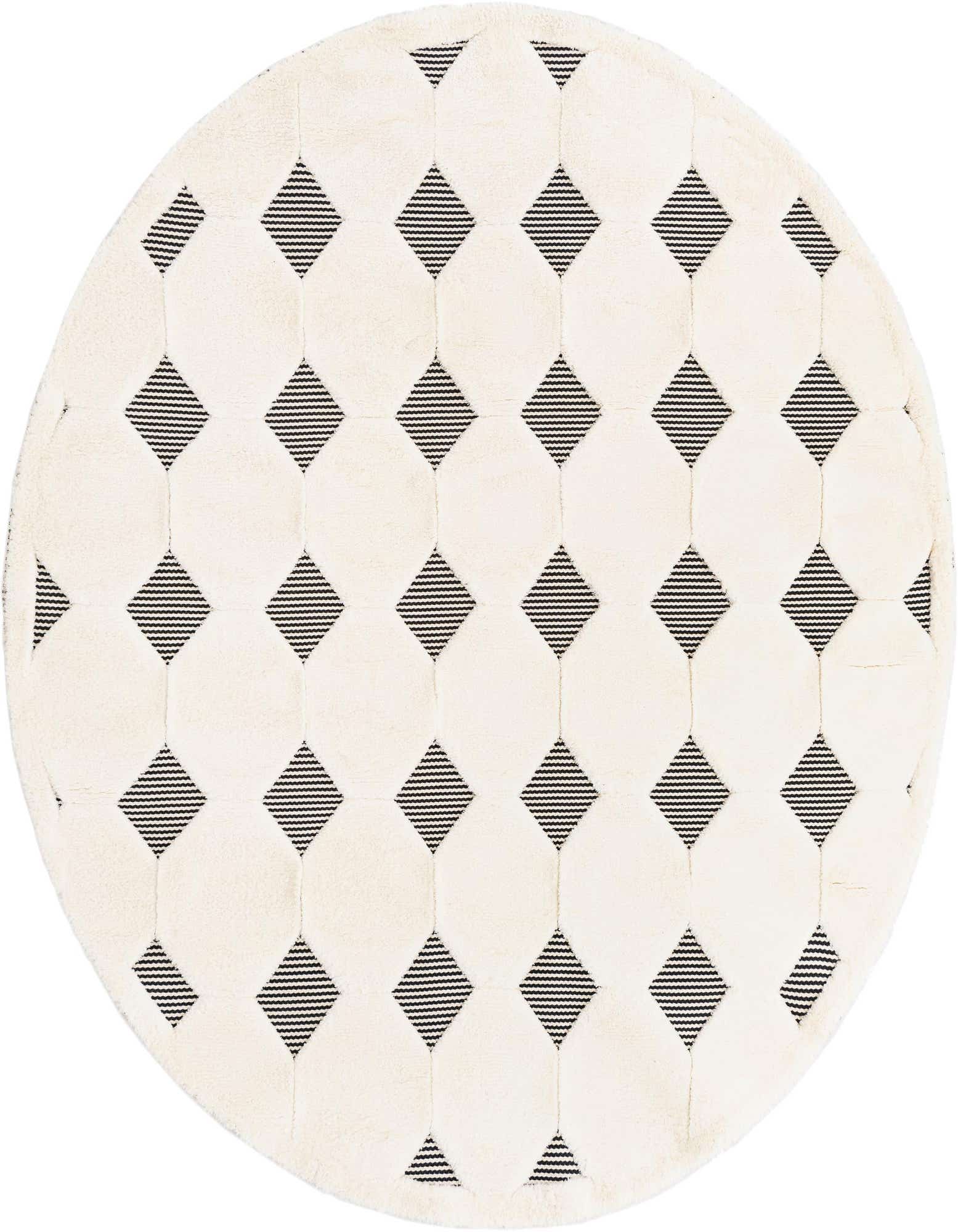 A round cream and black rug with a geometric pattern of raised cream circles and striped black diamond shapes.